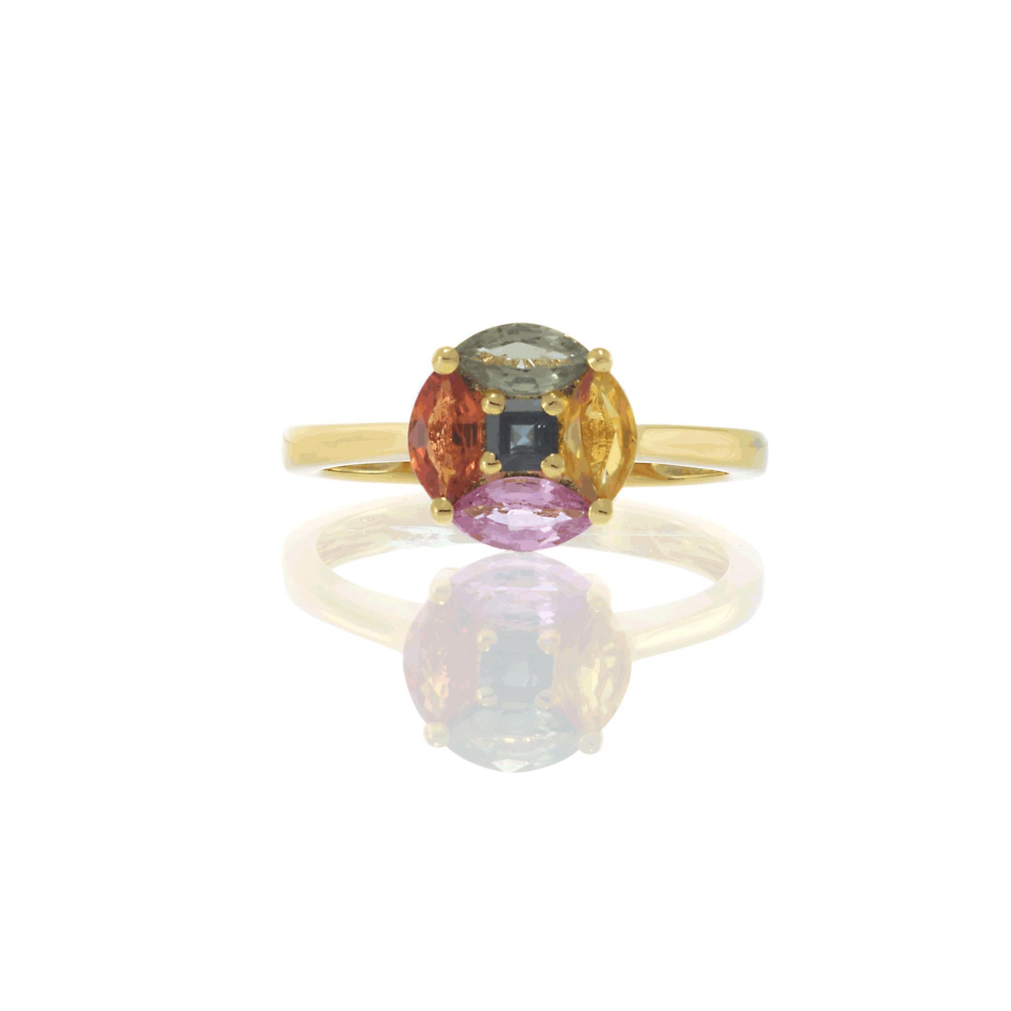 Celebrate the spectrum of color with this striking 18KT yellow gold ring, adorned with an artful mosaic of sapphires in a unique circular arrangement. Each genuine sapphire—totaling 1.34 carats—is hand-selected for its rich hue, from blush pink to