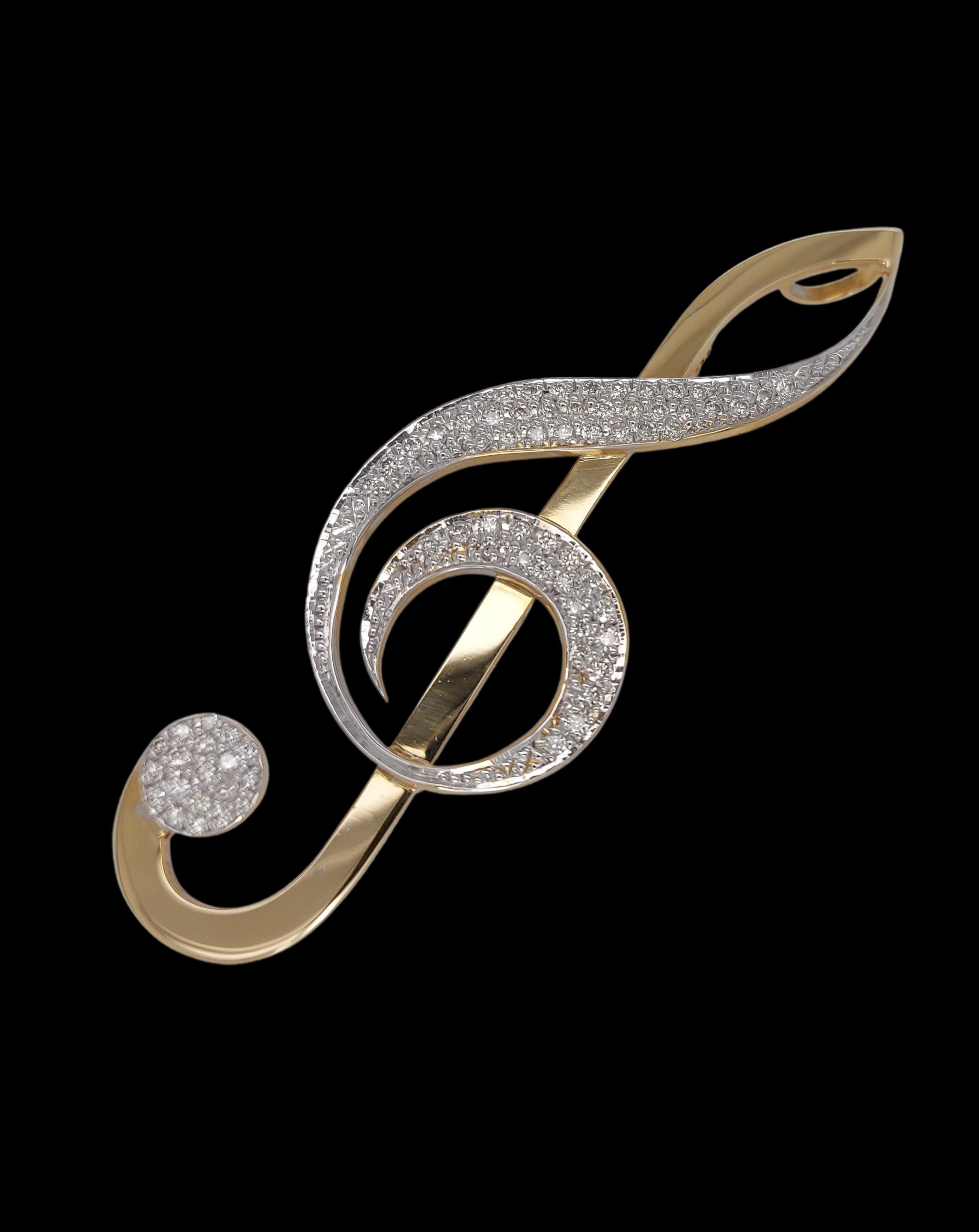 18kt Yellow Gold Music Note Necklace Hanger / Brooch  Diamonds set

Diamonds : 1.19 Ct. E/F  VVS/VS

Size : 25,8 mm wide , length 77,7 mm