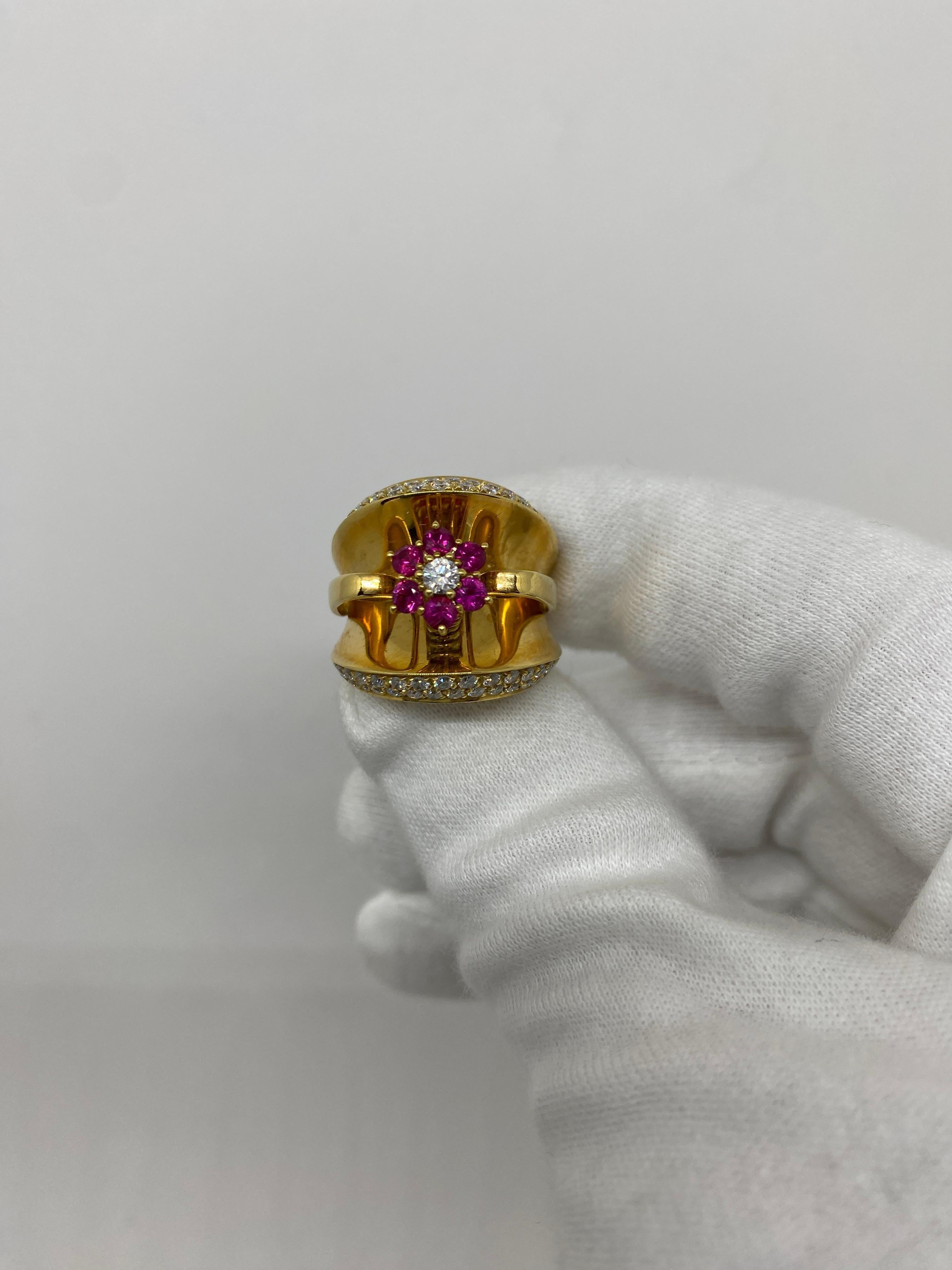 Ring made of 18kt yellow gold with brilliant-cut natural rubies for ct.0.67 and central brilliant-cut natural diamond for ct.0.69

Welcome to our jewelry collection, where every piece tells a story of timeless elegance and unparalleled
