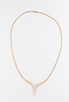 Collana in oro giallo 18kt con diamanti