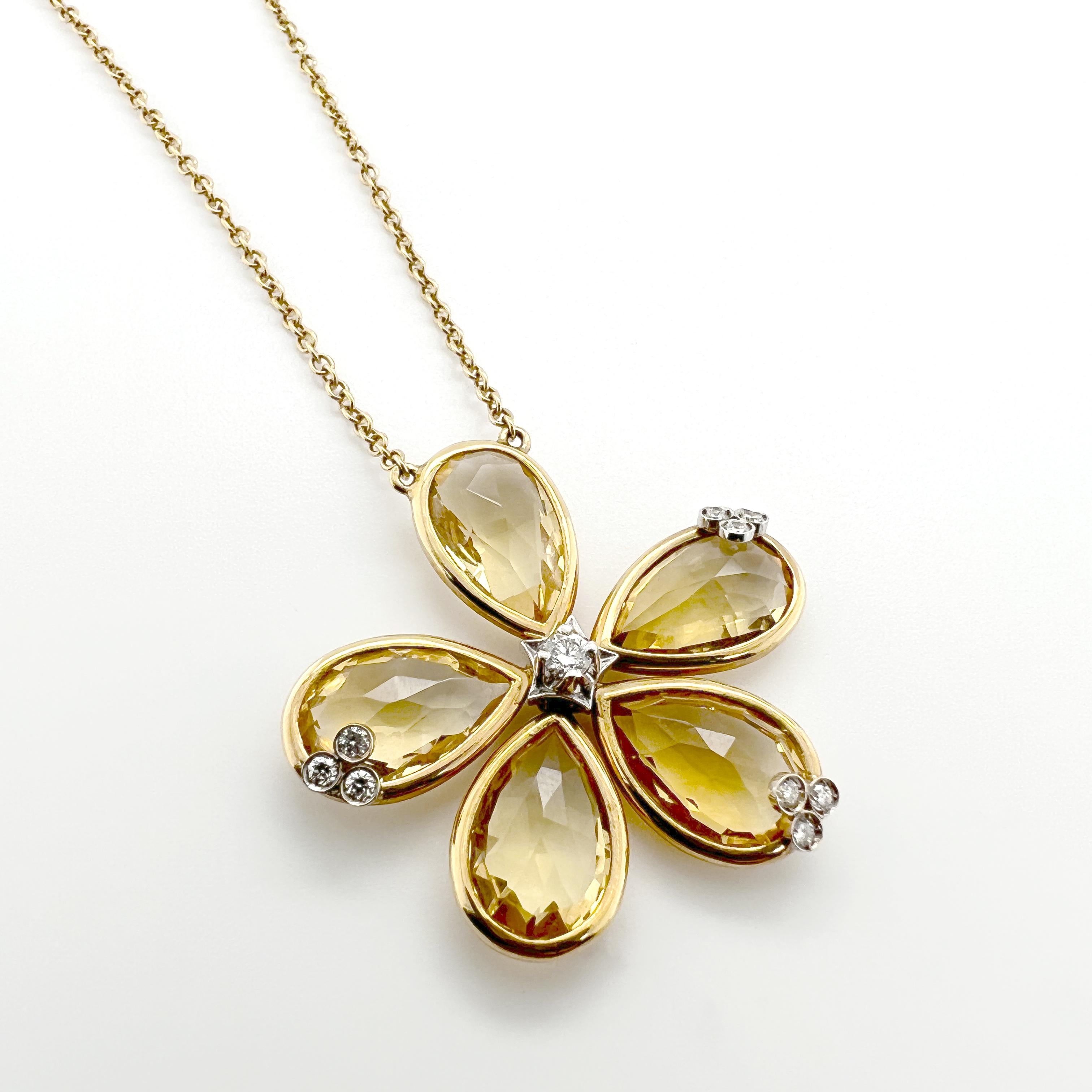 This 18kt gold necklace, part of the Bouquet collection, features a stunning flower pendant adorned with citrine quartz drops and diamonds. The flower design creates a delicate and feminine aesthetic that adds a touch of elegance to any outfit. The