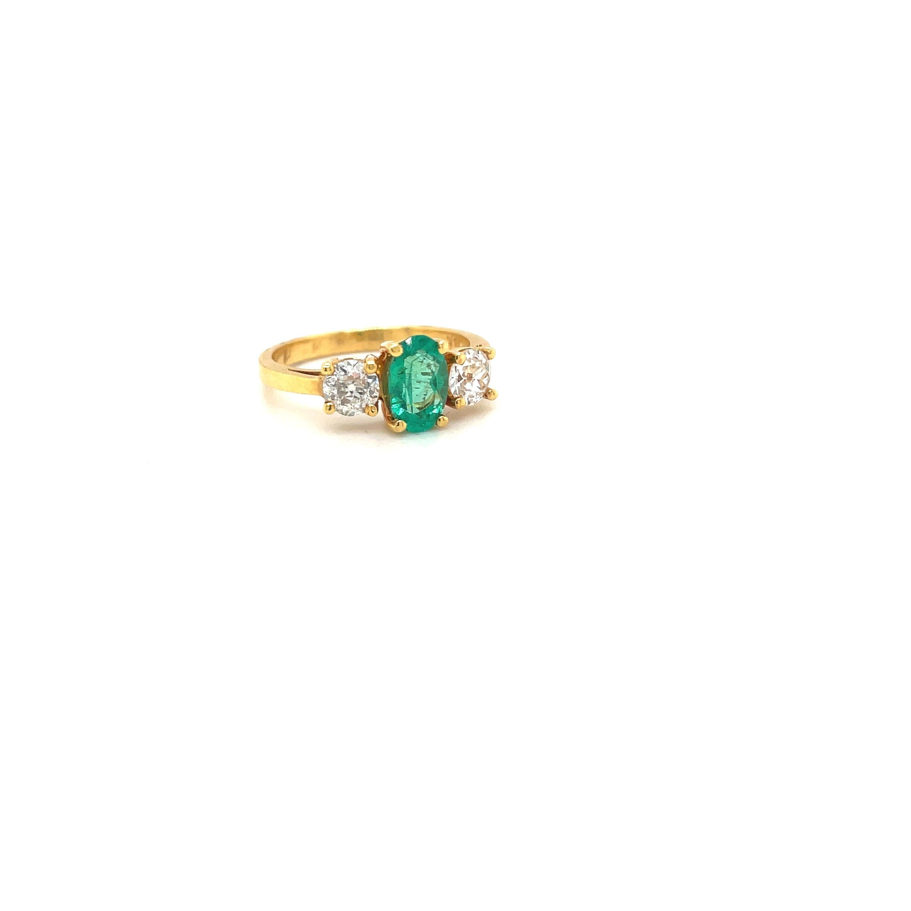 An oval emerald weighing 0.57carats is set in the center of this 18 karat yellow gold ring. The emerald is flanked by 2 round brilliant diamonds, total weight 0.46 carats.
Stamped 18K 5746
Size 6.25 sizing may be available
Cellini Jewelers 