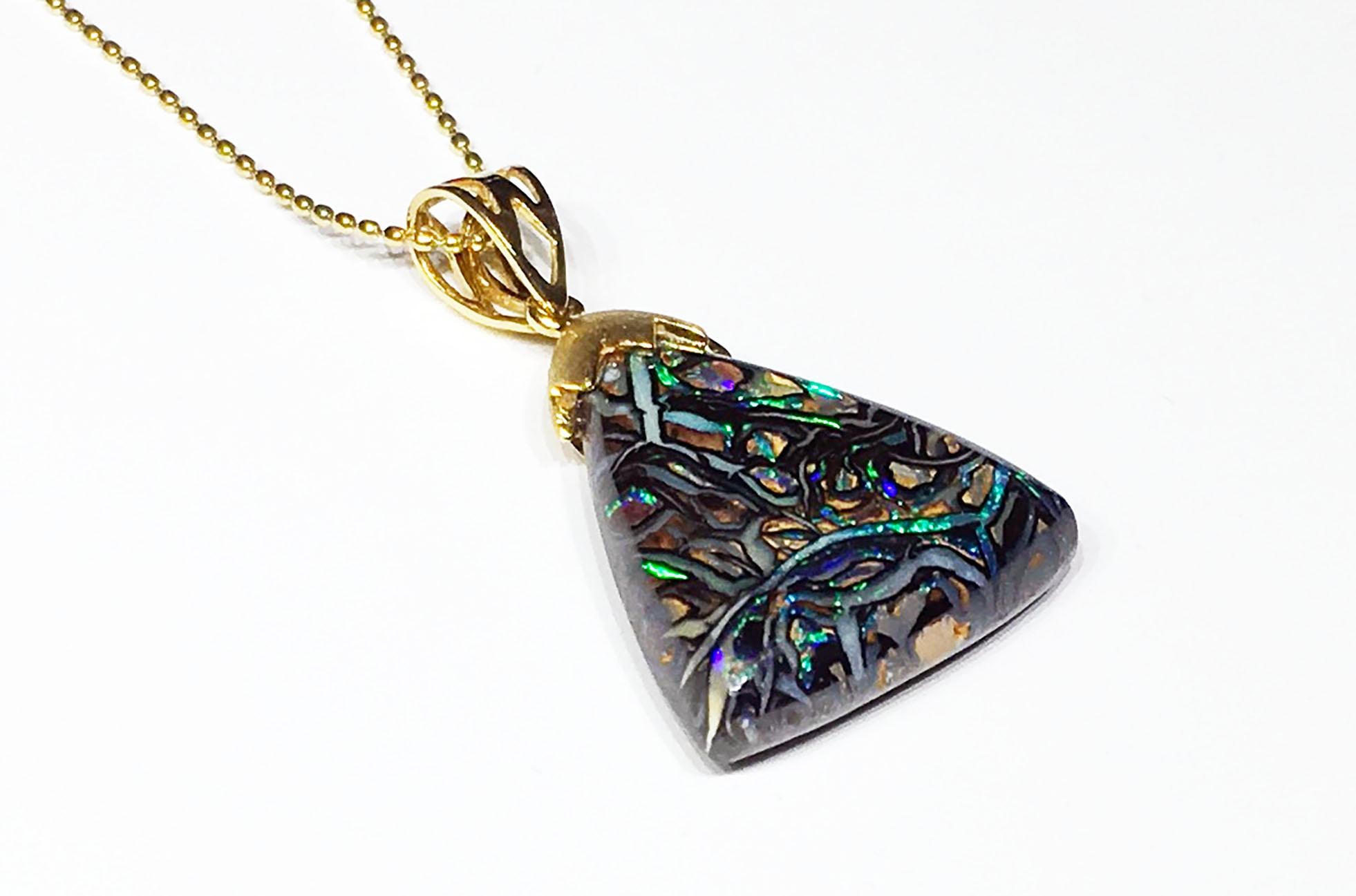 An Australian Boulder Opal Pendant set in 18kt Yellow Gold. In New Condition For Sale In Seattle, WA