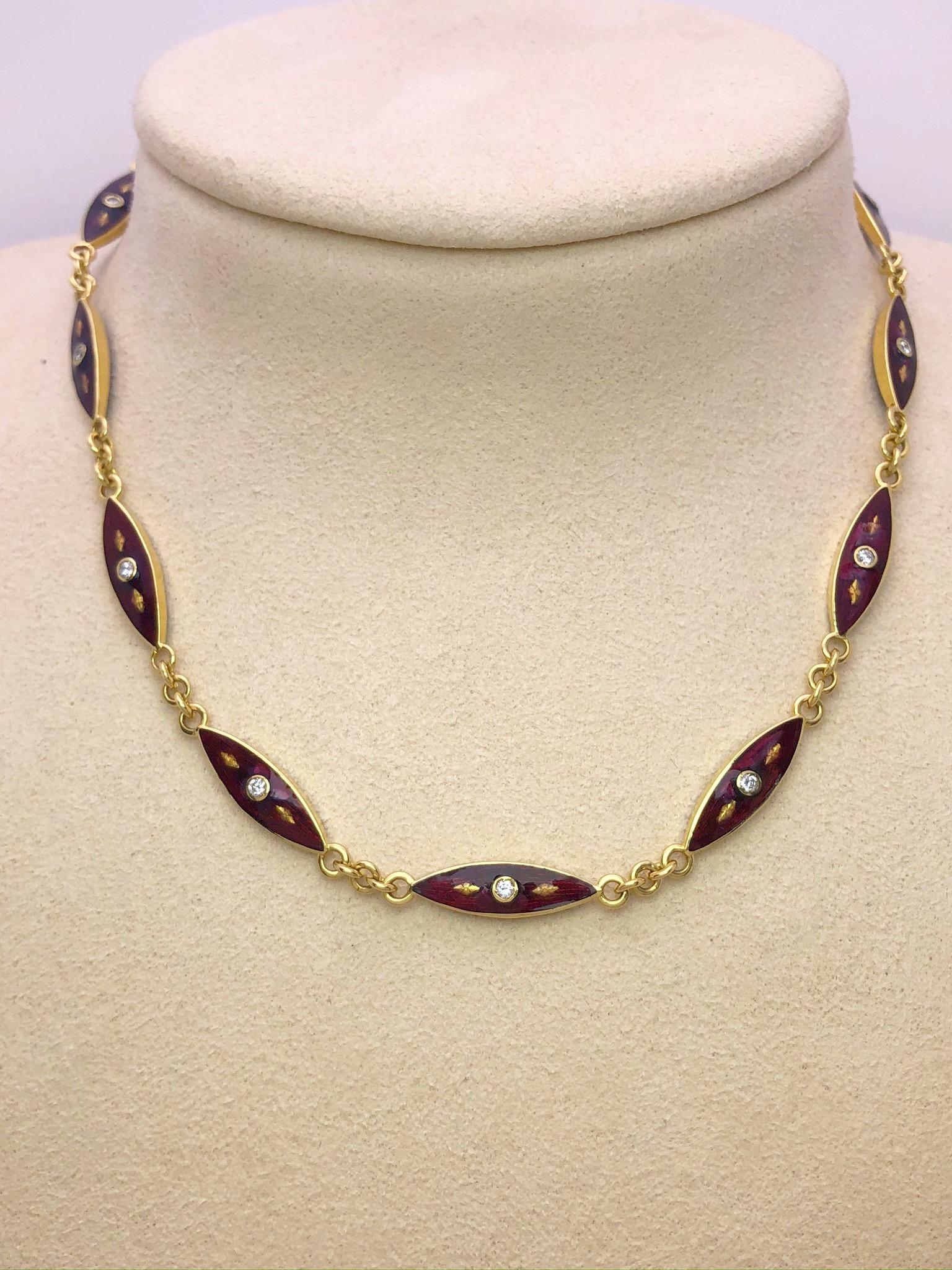 This vintage necklace is designed with 12 marquis shaped sections of 18 karat yellow gold with red enamel and diamond centers. Each piece has enamel and diamonds on both sides, this way when the sections move you are always seeing the beautiful