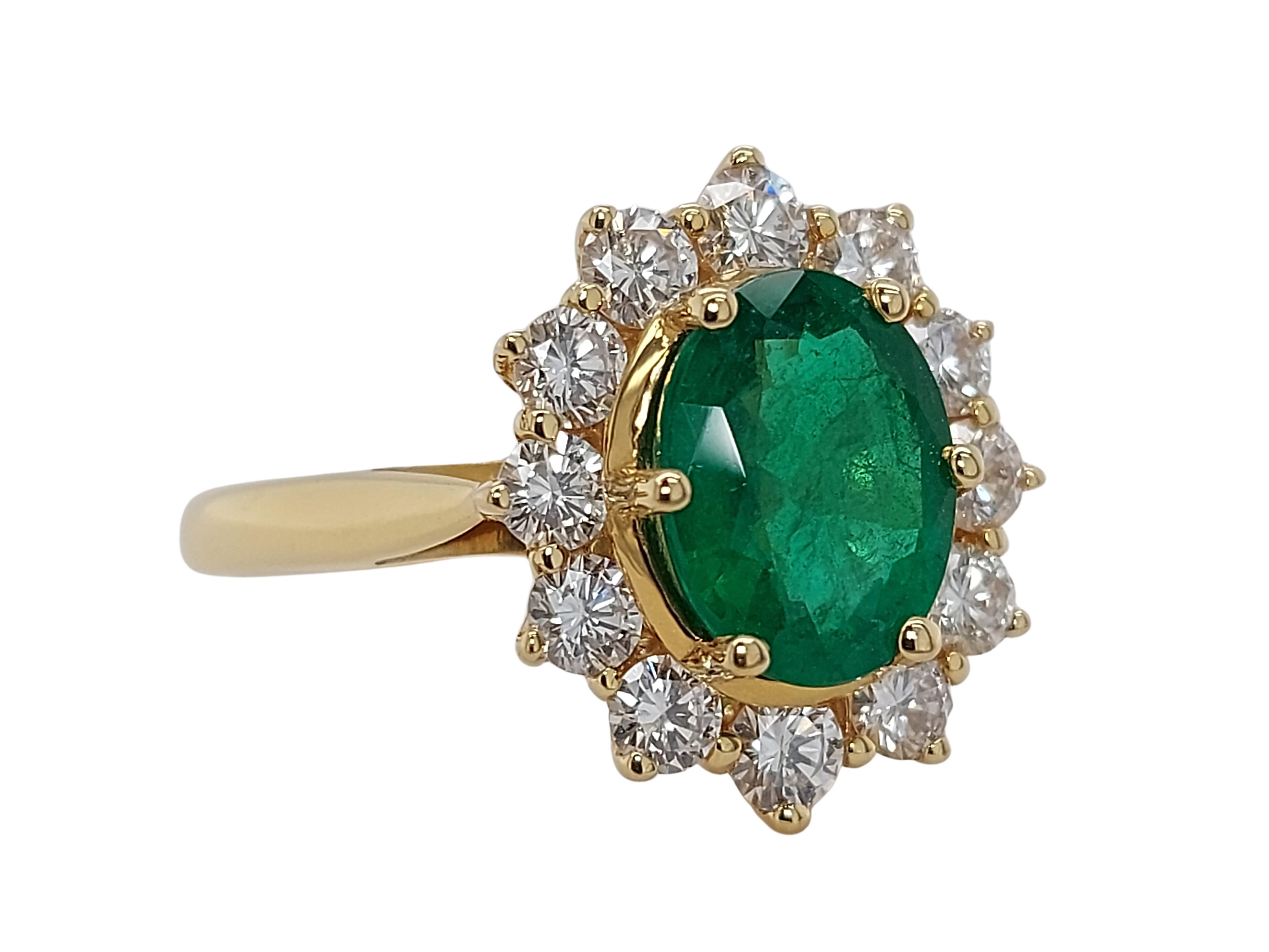 18kt Yellow Gold Ring with 1.75ct Emerald And 1.20ct Diamonds 
Beautiful deep green Natural  Emerald and brilliant cut diamonds ring.

Emerald is the most difficult stone to photograph due to Natural chromium in the stone,so the actual Emerald is