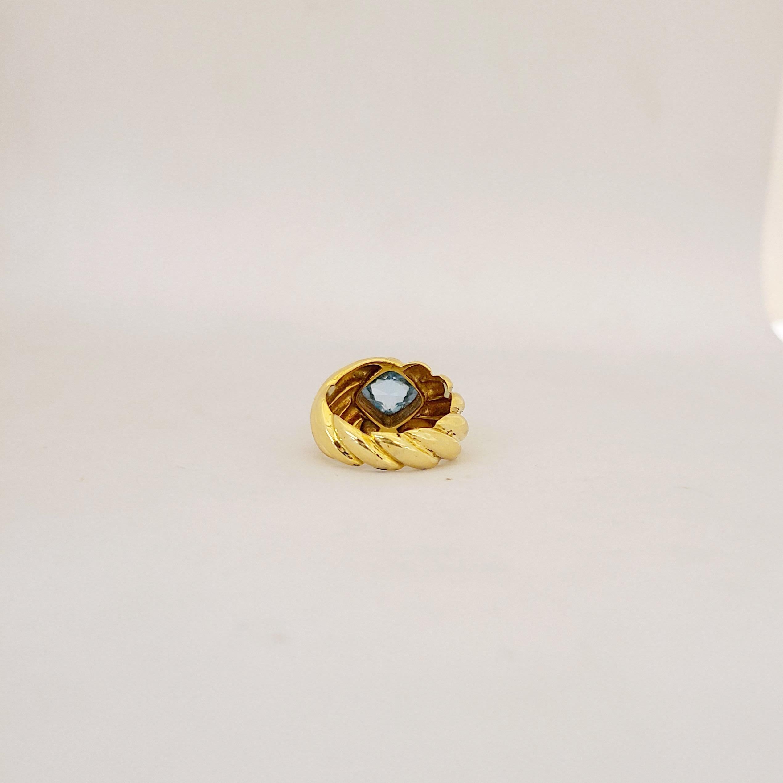 Contemporary 18 Karat Yellow Gold Ring with 2.80 Carat Cushion Cut Blue Topaz For Sale