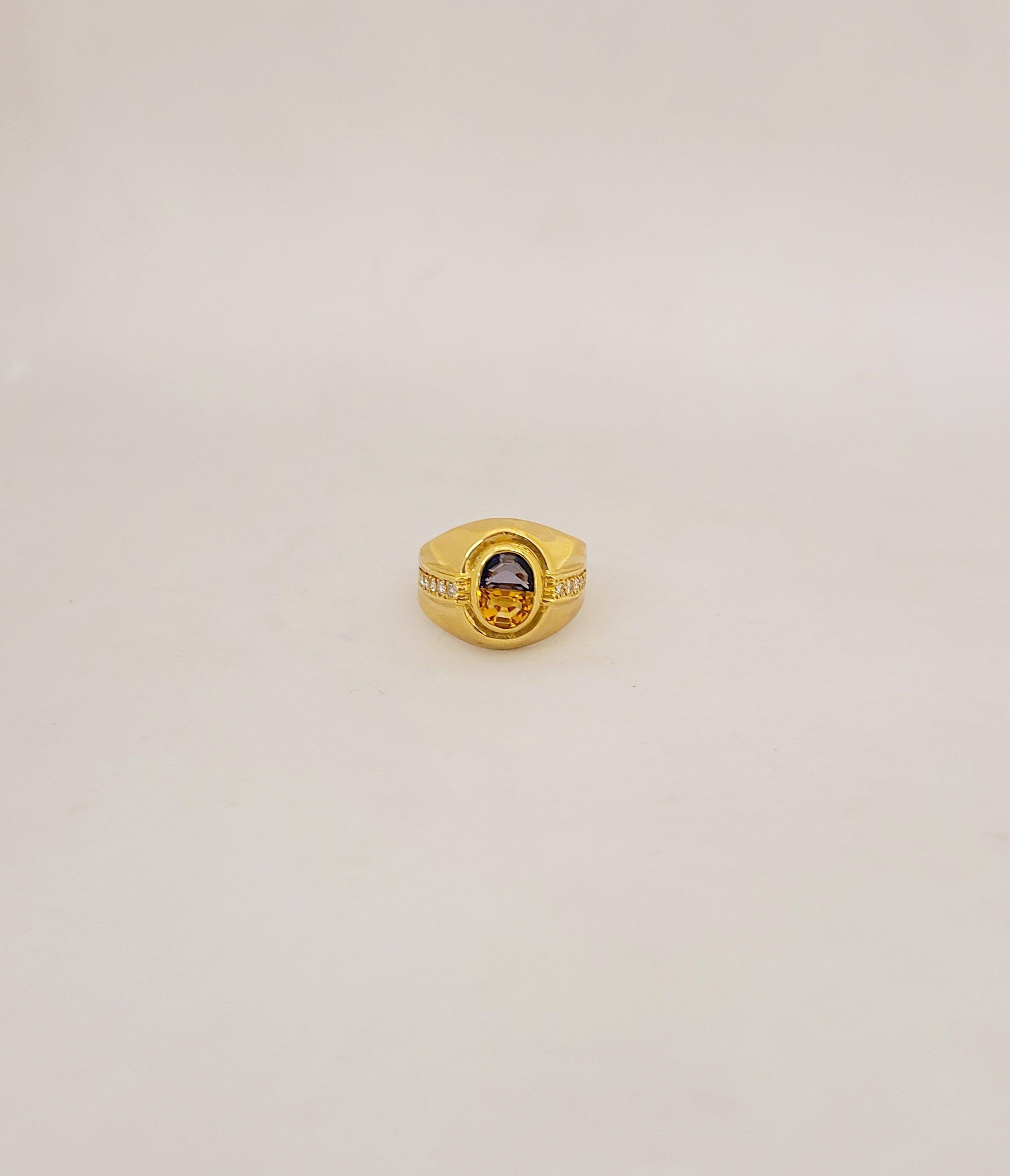 18KT Yellow Gold Ring centers a blue sapphire and citrine center - the stones are cut in a half moon shape forming an oval. The sides are flanked with 10 round brilliant diamonds totaling .26Ct.
Blue Sapphire: .65Ct
Citrine: .65Ct.
Ring Size 7. 75
