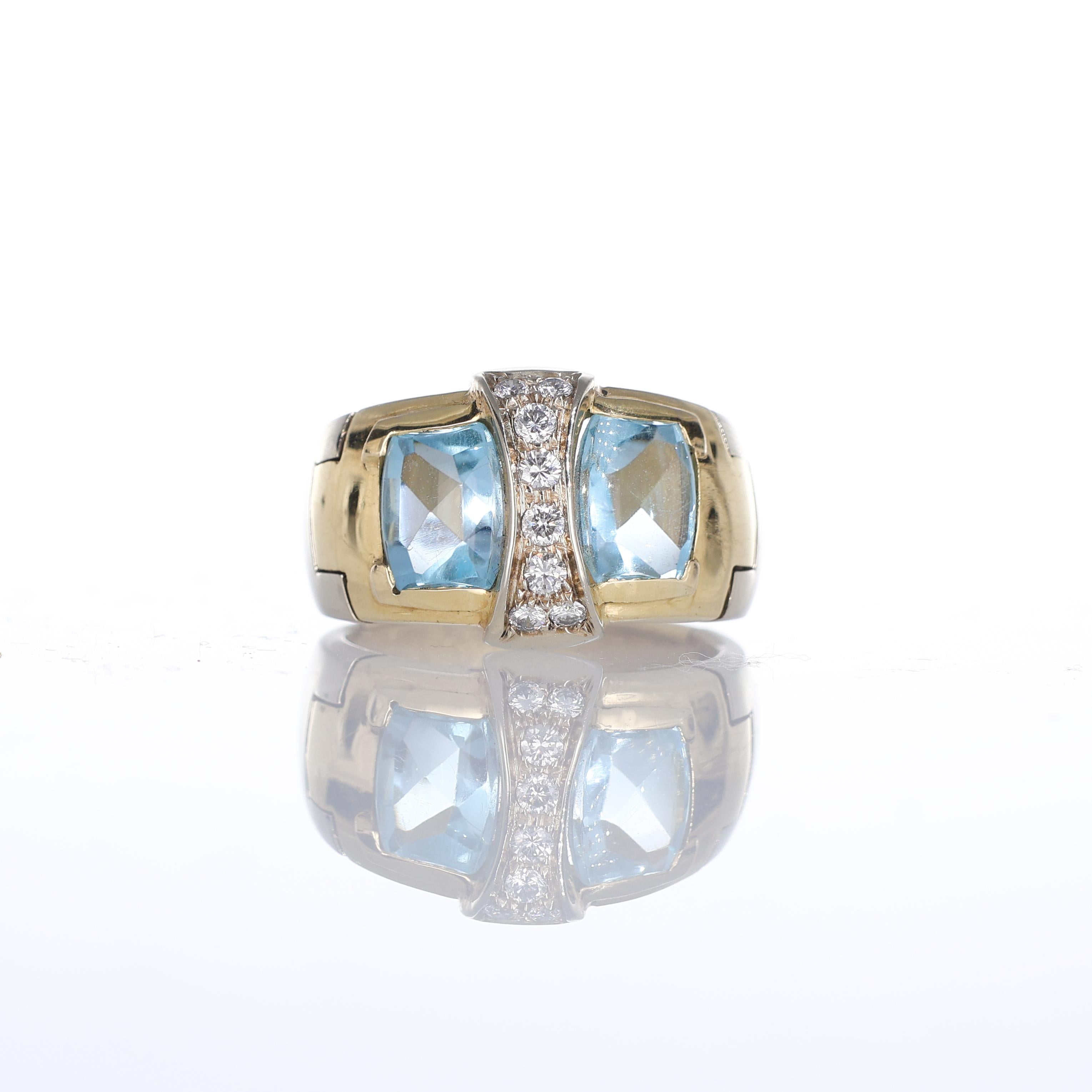IMPORTANT NOTE:
✔ No additional costs will be added to this order.
✔ Shipping and customs duties are fully covered by us.
--------------------
A refined 18kt yellow gold ring featuring two radiant blue topazes with a geometric cut, framed by natural