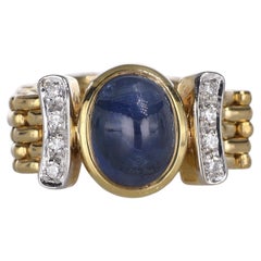 Ring aus 18 Karat Gelbgold mit Cabochon-Saphir und Diamanten