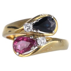 18kt Yellow Gold Ring with Contrasting Pear-Cut Ruby and Sapphire, and Diamonds
