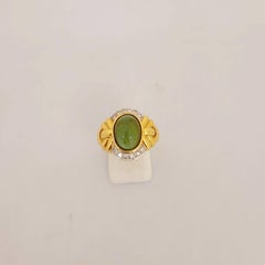 18 Karat Yellow Gold Ring with Green Tourmaline and .25 Carat Diamonds