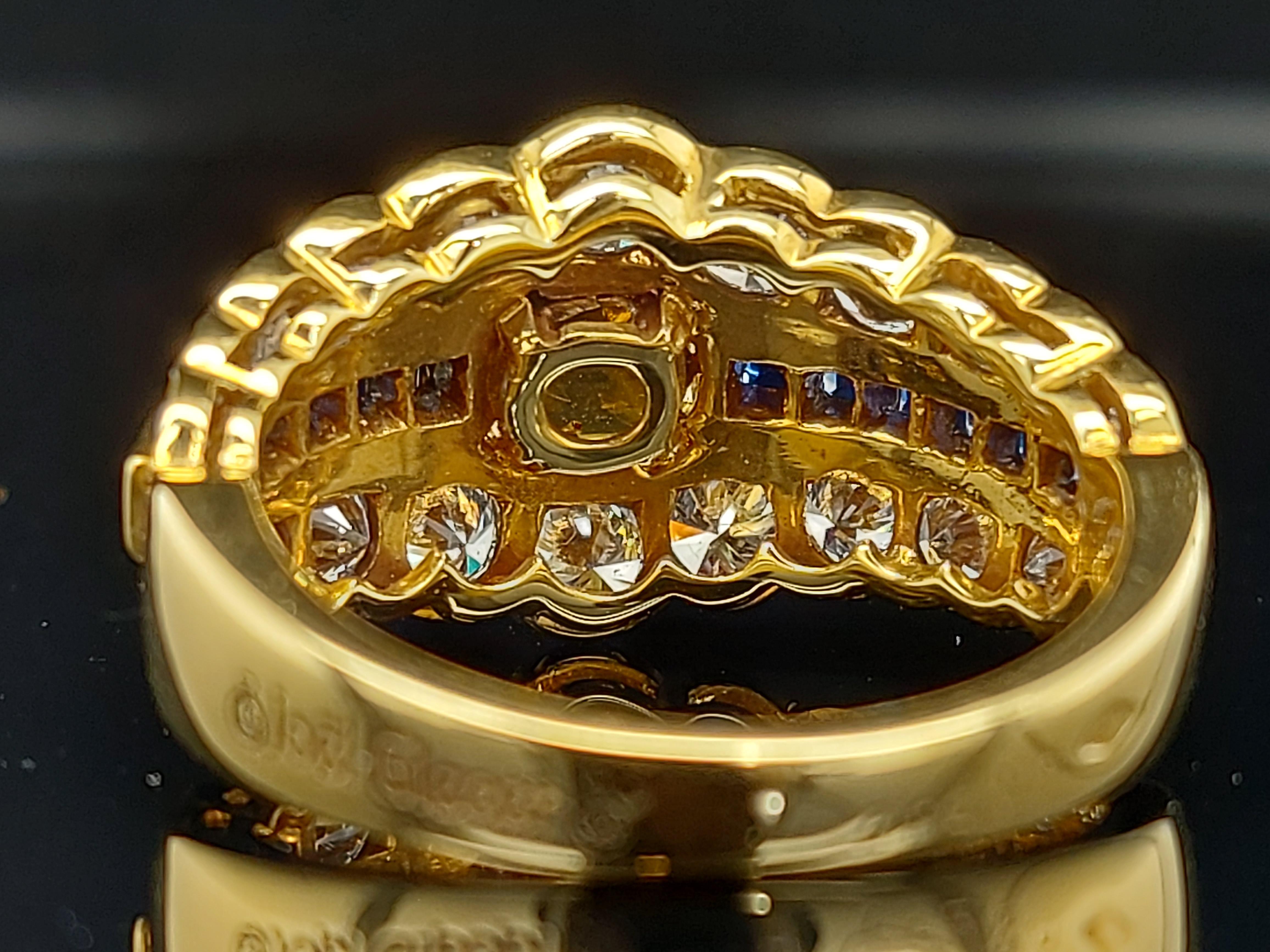 18 Karat Yellow Gold Ring with Large Yellow Sapphire Blue Sapphires and Diamonds For Sale 7