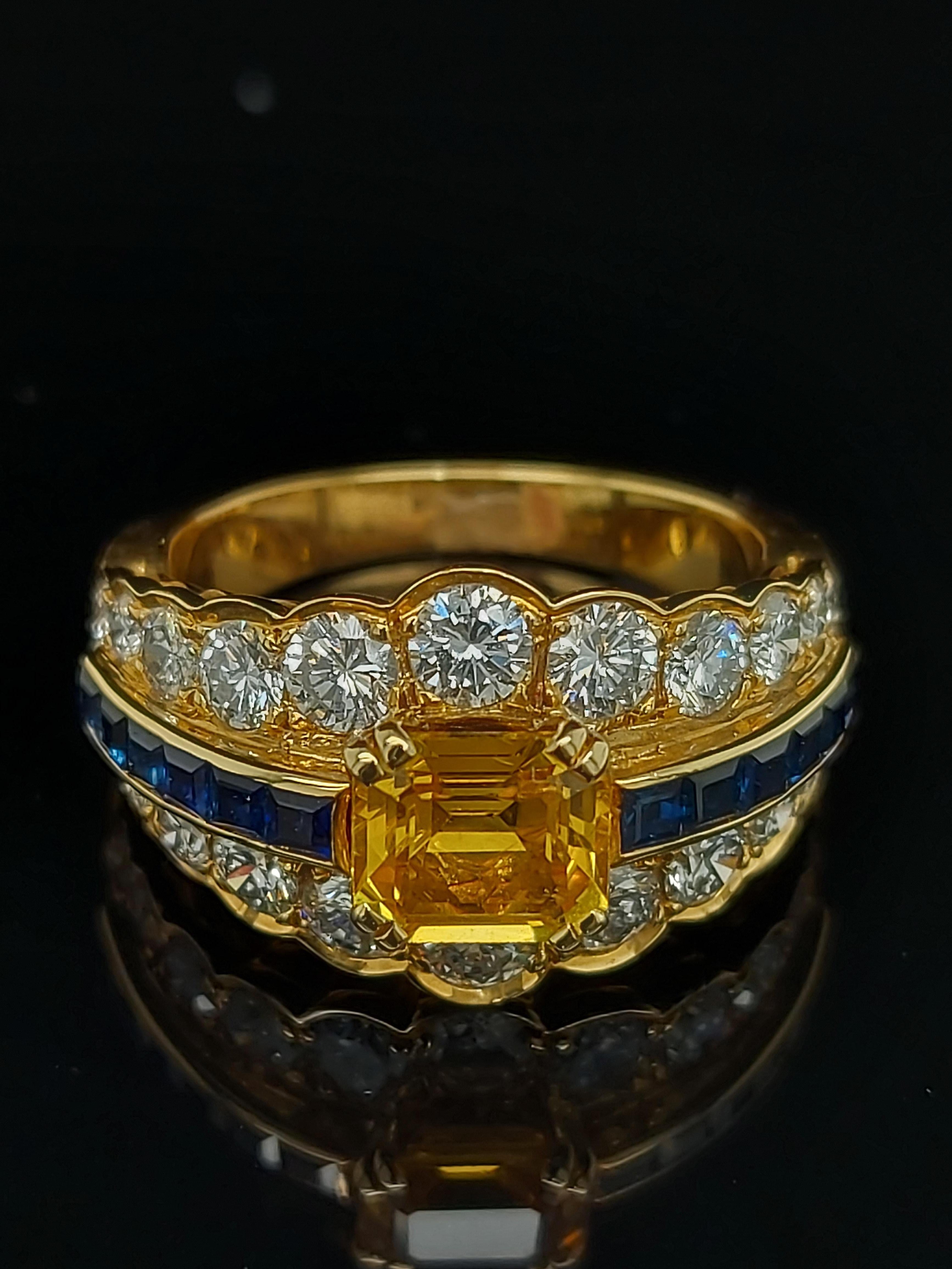 Artisan 18 Karat Yellow Gold Ring with Large Yellow Sapphire Blue Sapphires and Diamonds For Sale