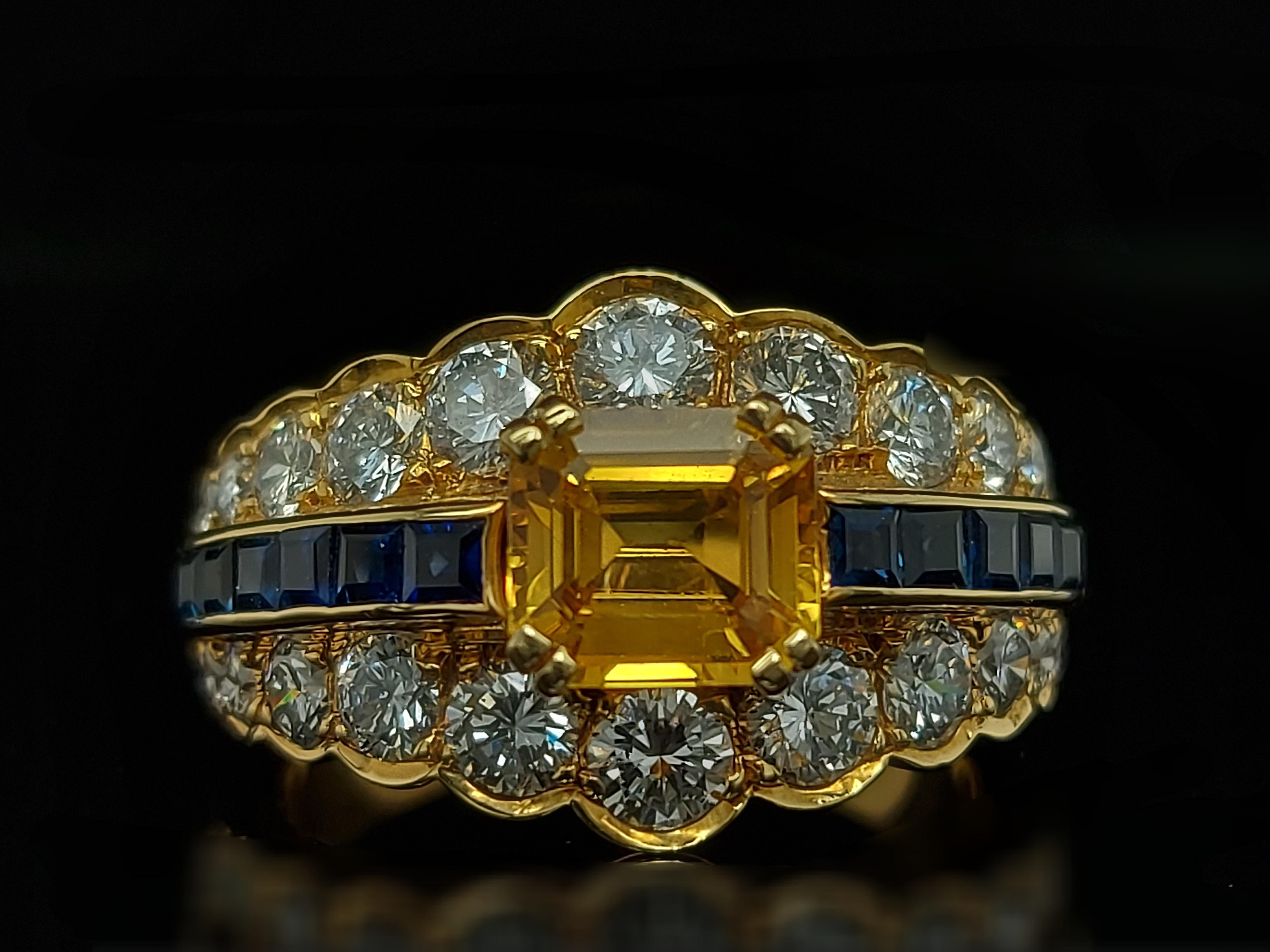 18 Karat Yellow Gold Ring with Large Yellow Sapphire Blue Sapphires and Diamonds For Sale 1