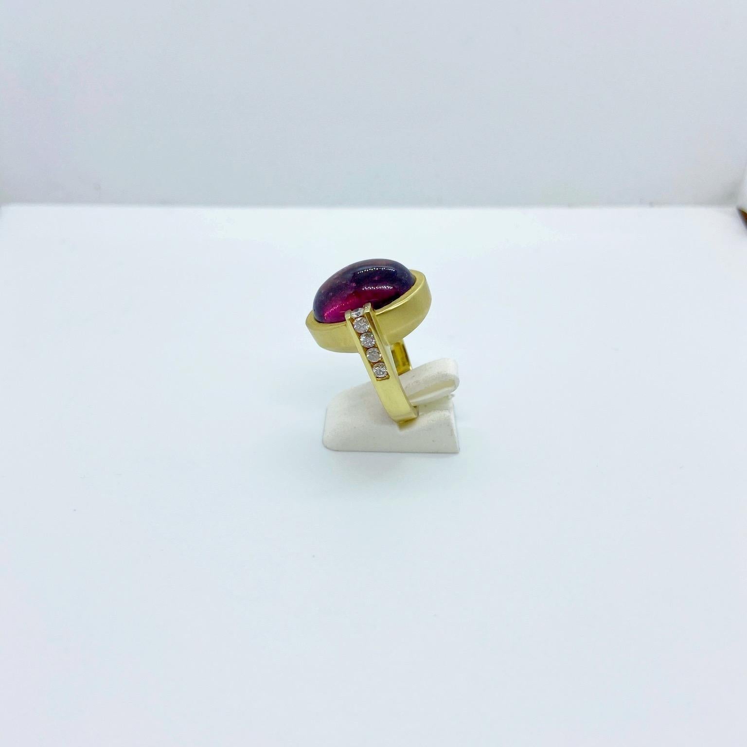 Modern 18 Karat Yellow Gold Ring with Oval Cabochon Rubellite and .65 Carat Diamonds For Sale