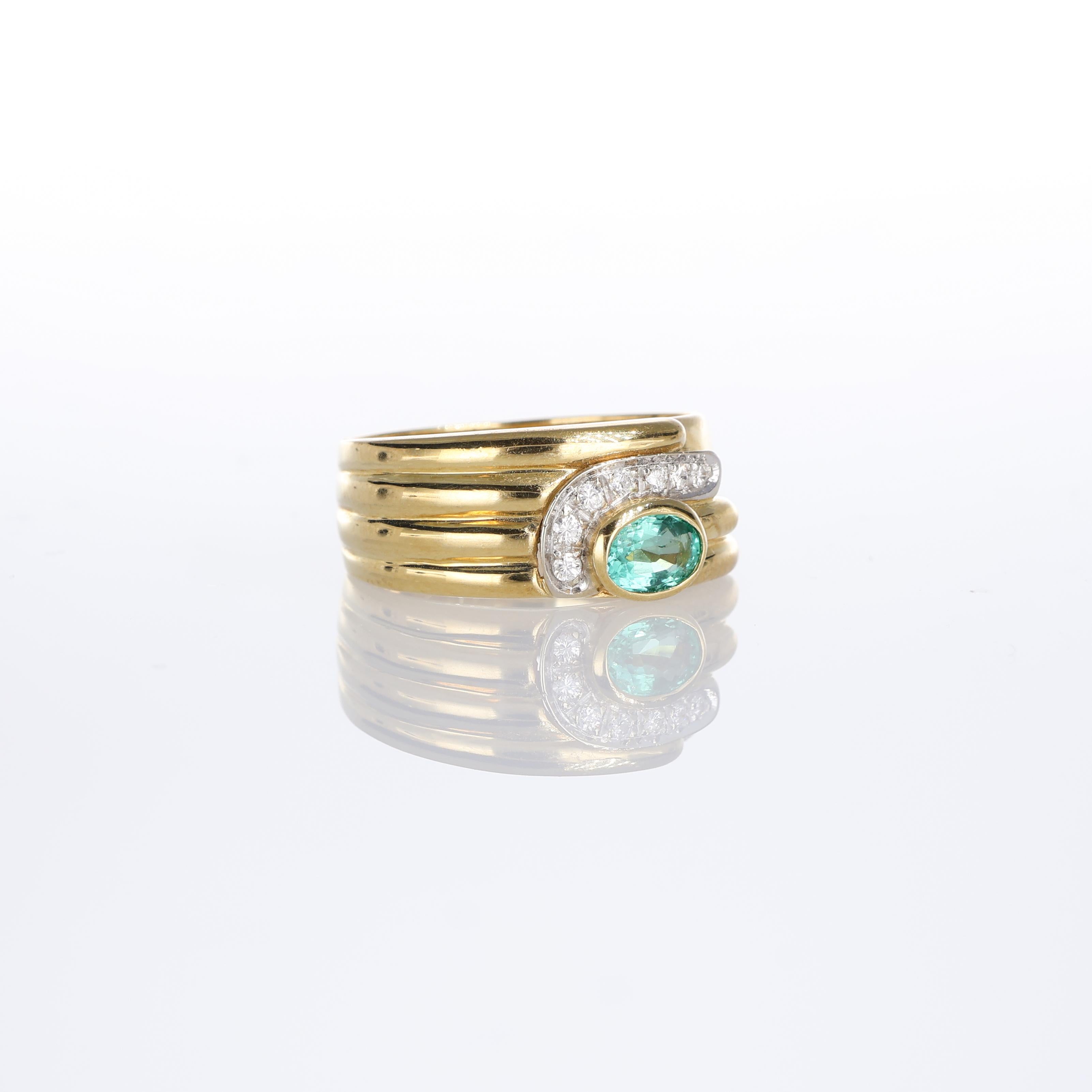 Brilliant Cut 18kt Yellow Gold Ring with Oval Emerald and Pave Diamond Detail For Sale