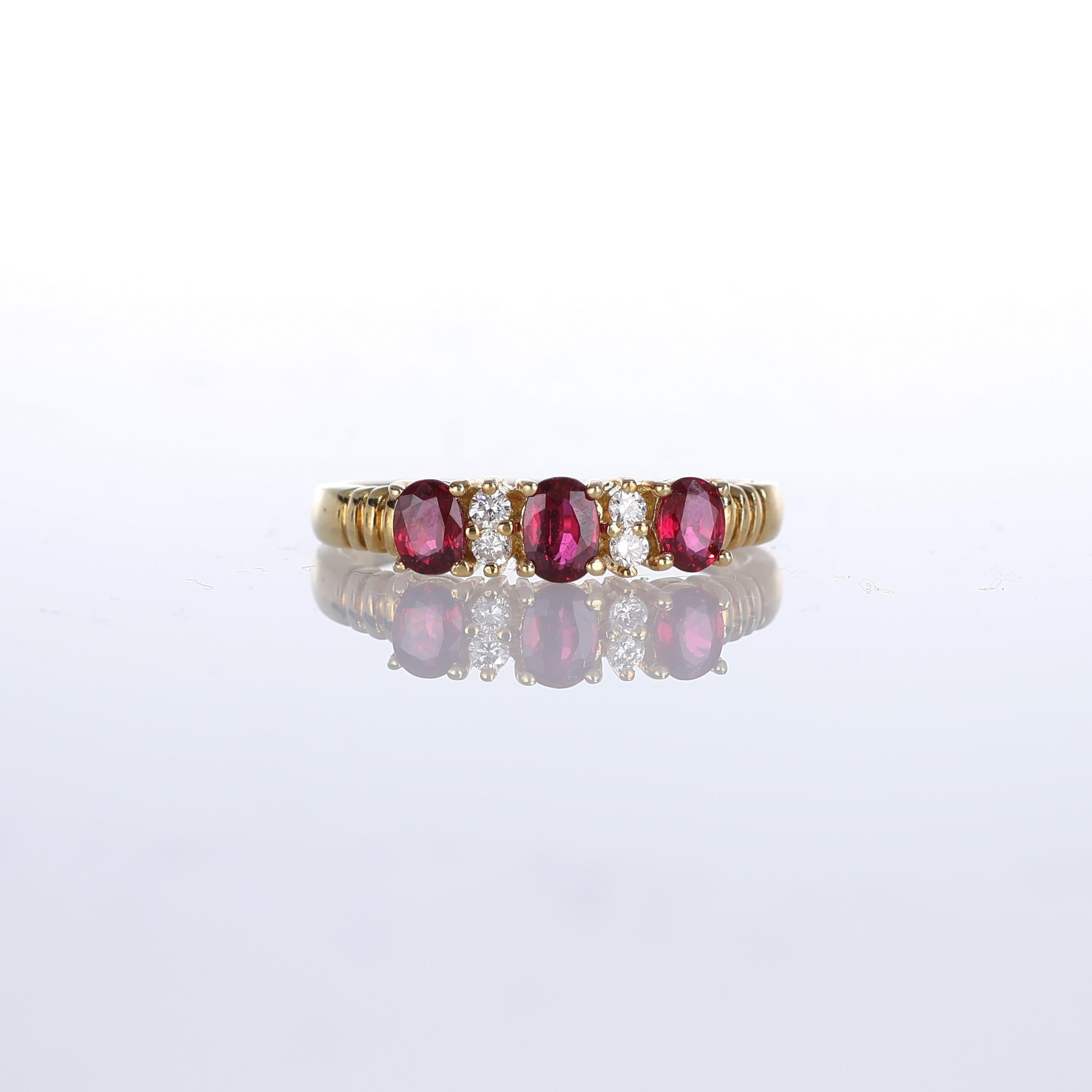 IMPORTANT NOTE:
✔ No additional costs will be added to this order.
✔ Shipping and customs duties are fully covered by us.
--------------------
This elegant 18kt yellow gold ring features a row of vibrant oval-cut rubies interspersed with sparkling