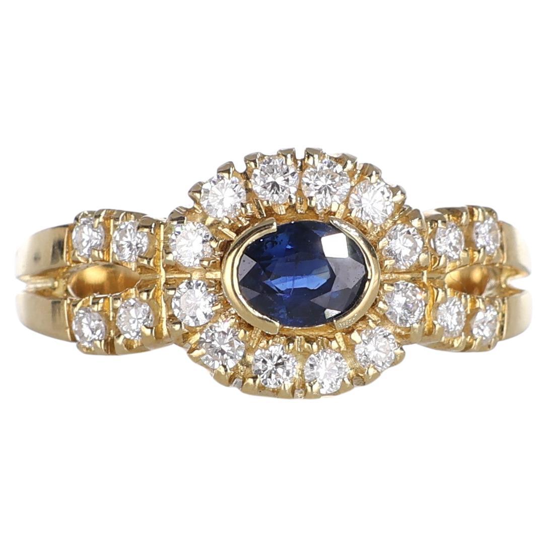 18kt Yellow Gold Ring with Oval Sapphire and Diamond Halo