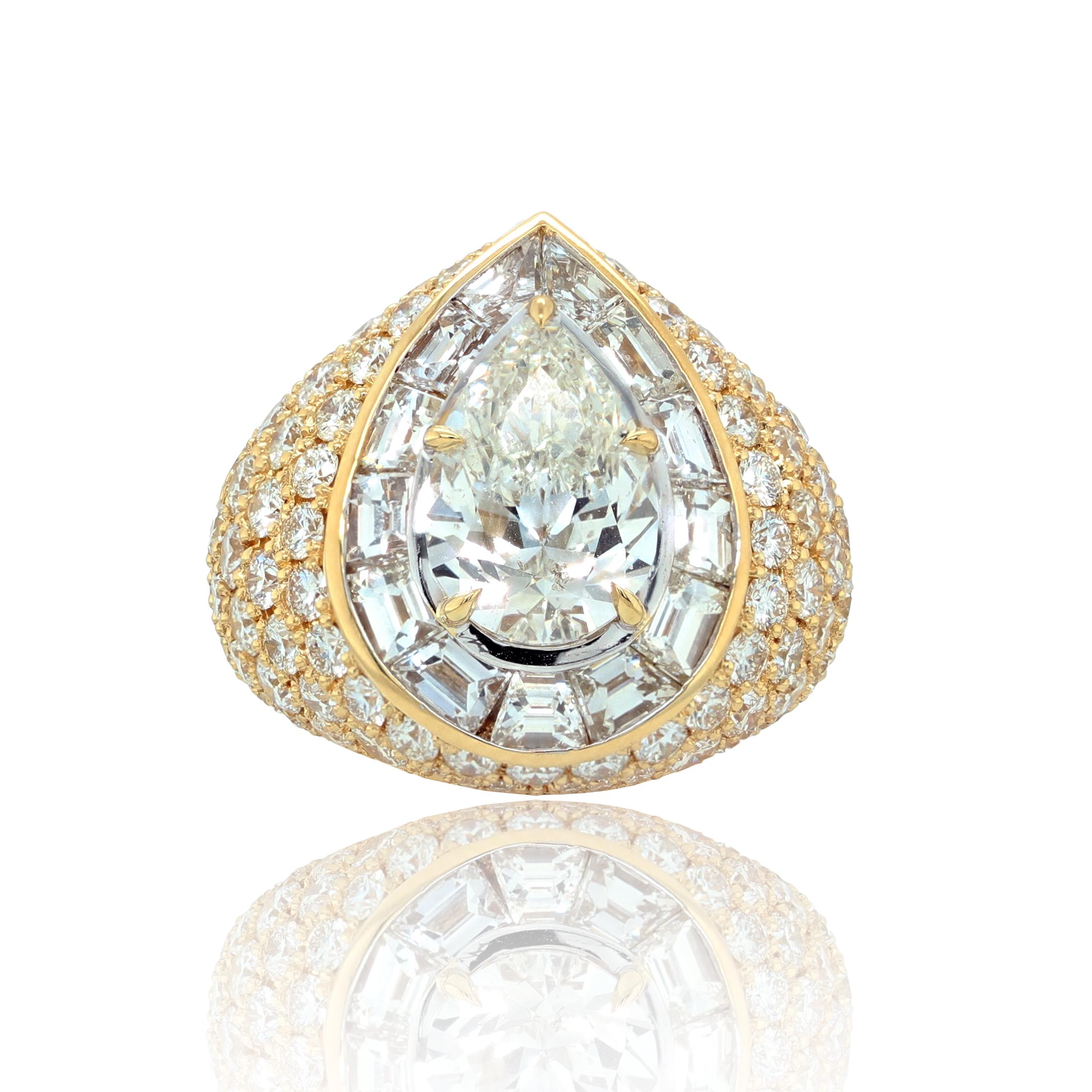 18kt yellow gold pear shape diamond ring center stone 3.50ct G-SI2 GIA certified (psc274) in a emerald halo setting and round diamonds on the side with total weight of 8.30 ct 
