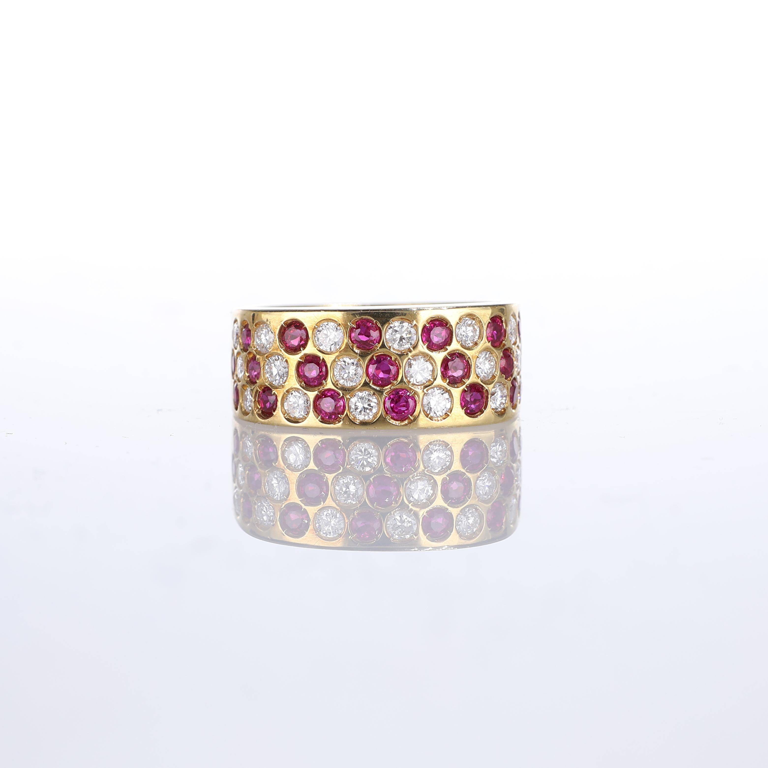IMPORTANT NOTE:
✔ No additional costs will be added to this order.
✔ Shipping and customs duties are fully covered by us.
--------------------
This striking 18kt yellow gold band ring features a bold diagonal pattern of alternating rubies and