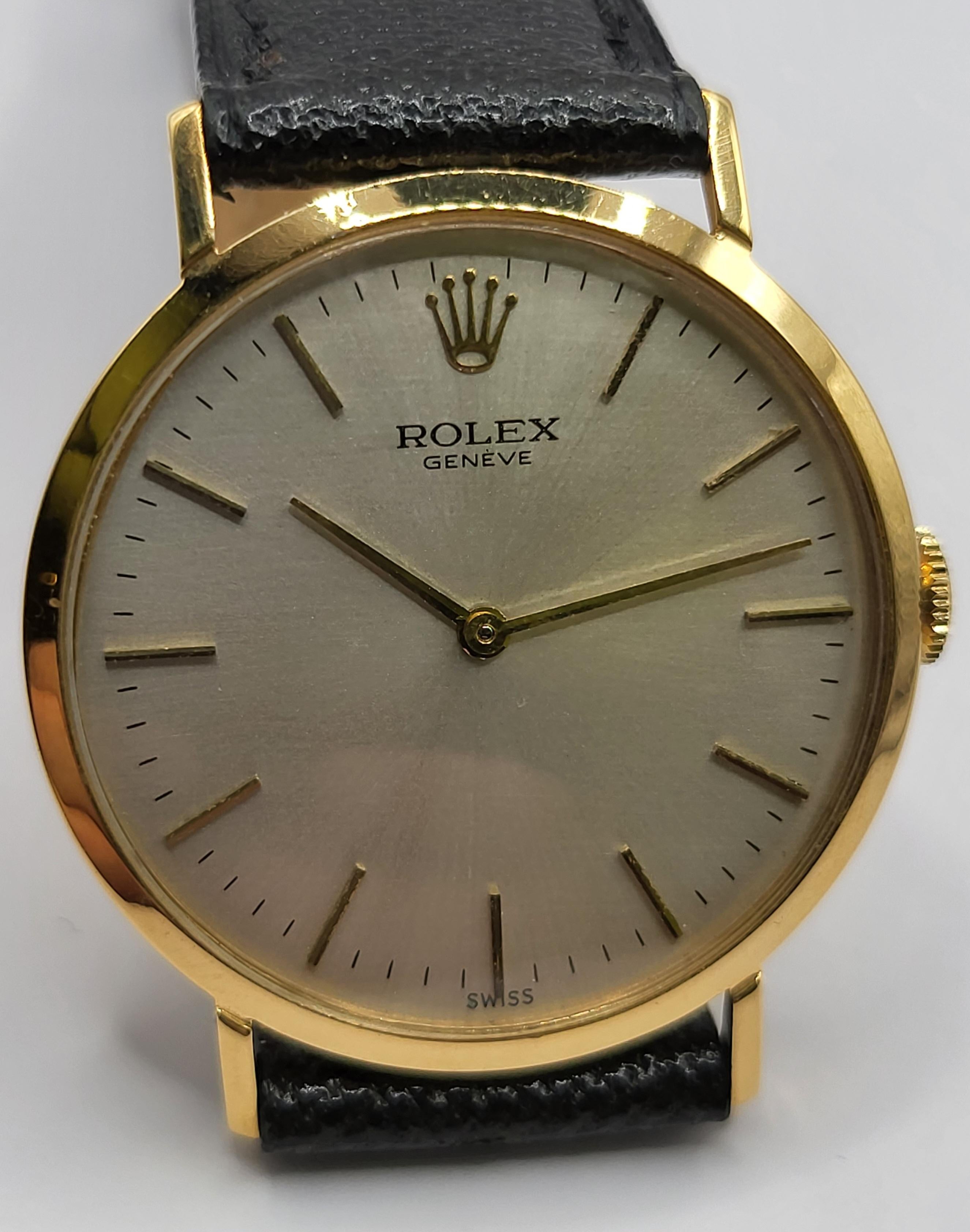 18kt Gold Rolex Dress Wrist Watch

Movement: Mechanical with Manual Movement Caliber 1600

Functions: Hours, Minutes

Case: 18kt yellow gold case,  diameter 31 mm x 7mm, 

Dial: Silver Brushed dial with golden indexes

Strap: Black leather strap,