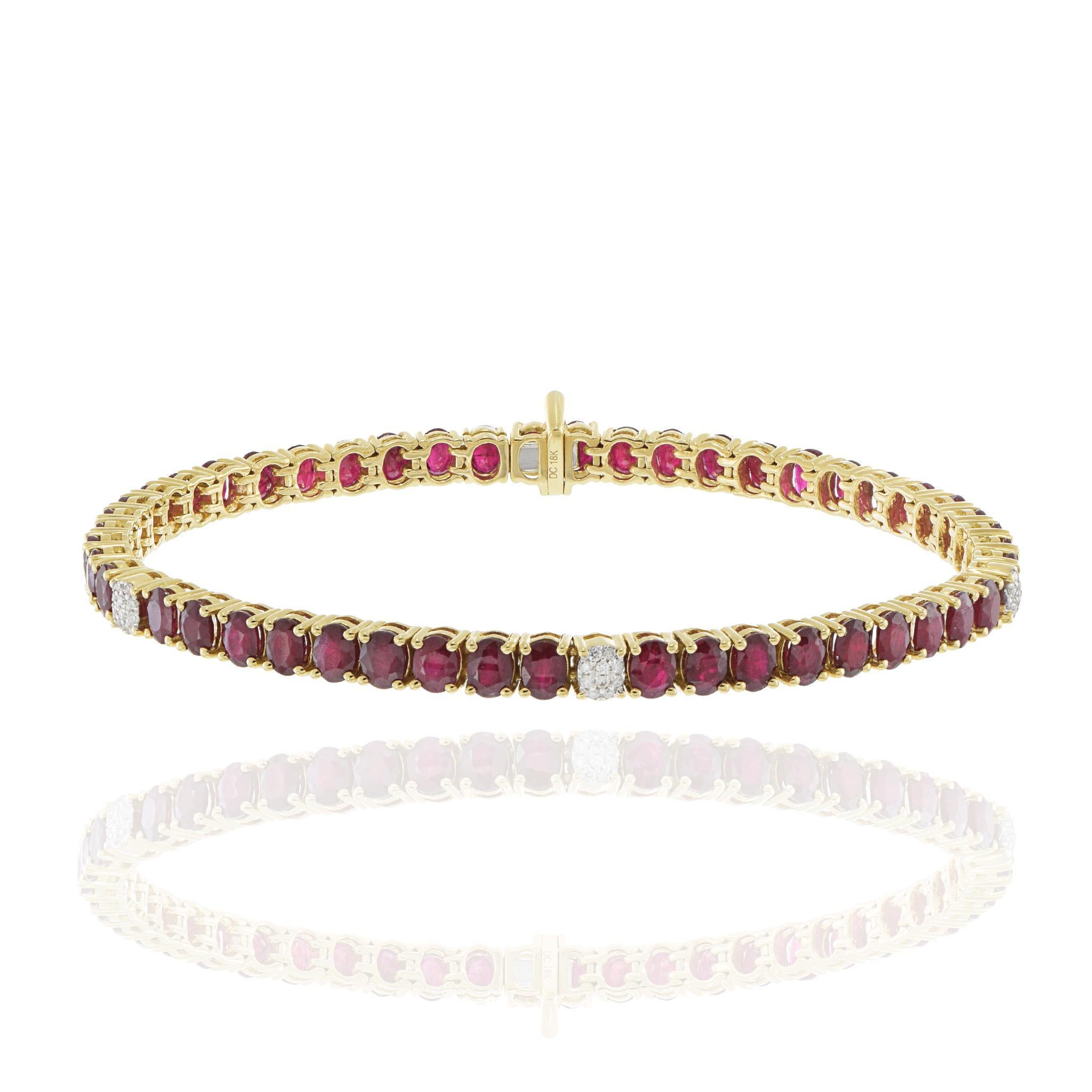 Elegantly crafted in 18k yellow gold, this tennis bracelet showcases a stunning array of oval-cut red rubies, totaling 10.57 carats. Interspersed with these vibrant gems are round-cut white diamonds, adding a touch of brilliance with a total weight