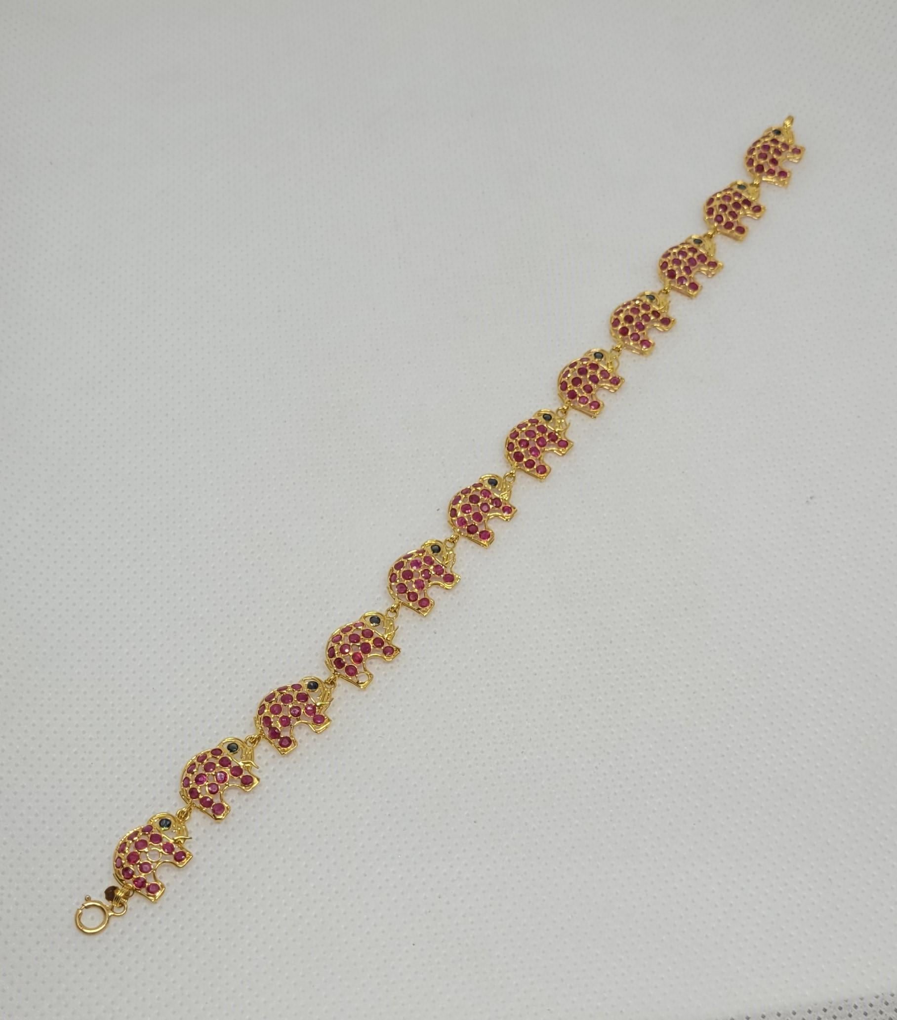 Artisan 18kt Yellow Gold Ruby Sapphire Elephant Link Bracelet 7 Inches 10mm Wide 6 gr For Sale