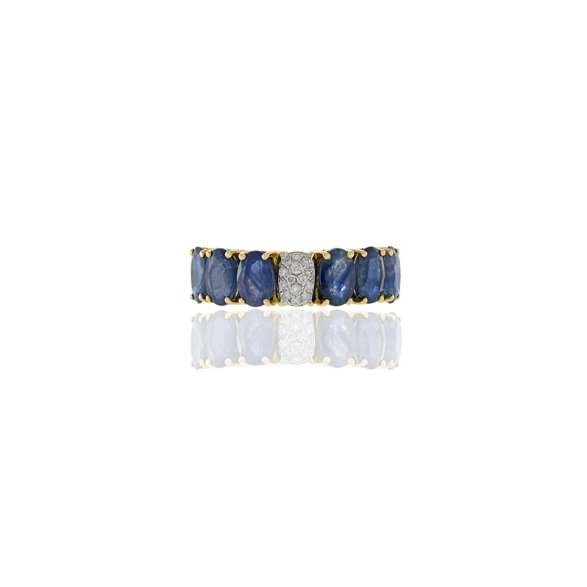 18KT yellow gold ring consisting of 4.24CT-TW oval sapphires and 0.08CT-TW of round cut diamonds. It's a luxurious design with an impressive sparkle. Premium quality gold and stones combine to create a timeless look. Size 7 US. Weight 4.5 gm.