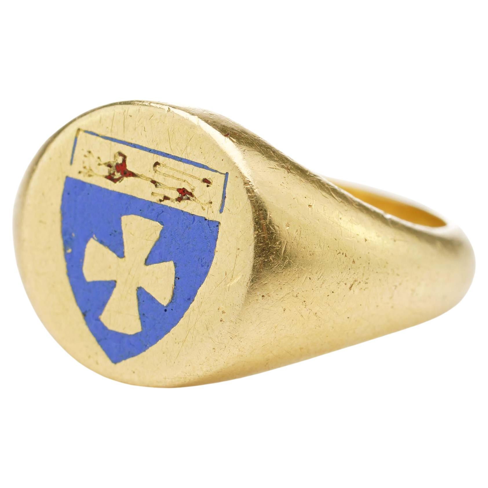 Antique 18kt. yellow gold signet ring with coat of arms and Delta Tau Delta symbol. 
The coat of arms features a shield with a lion rampant and cross pattée. 

The cross pattée (or cross patty, also known as a cross formée/formy, Croix pattée or