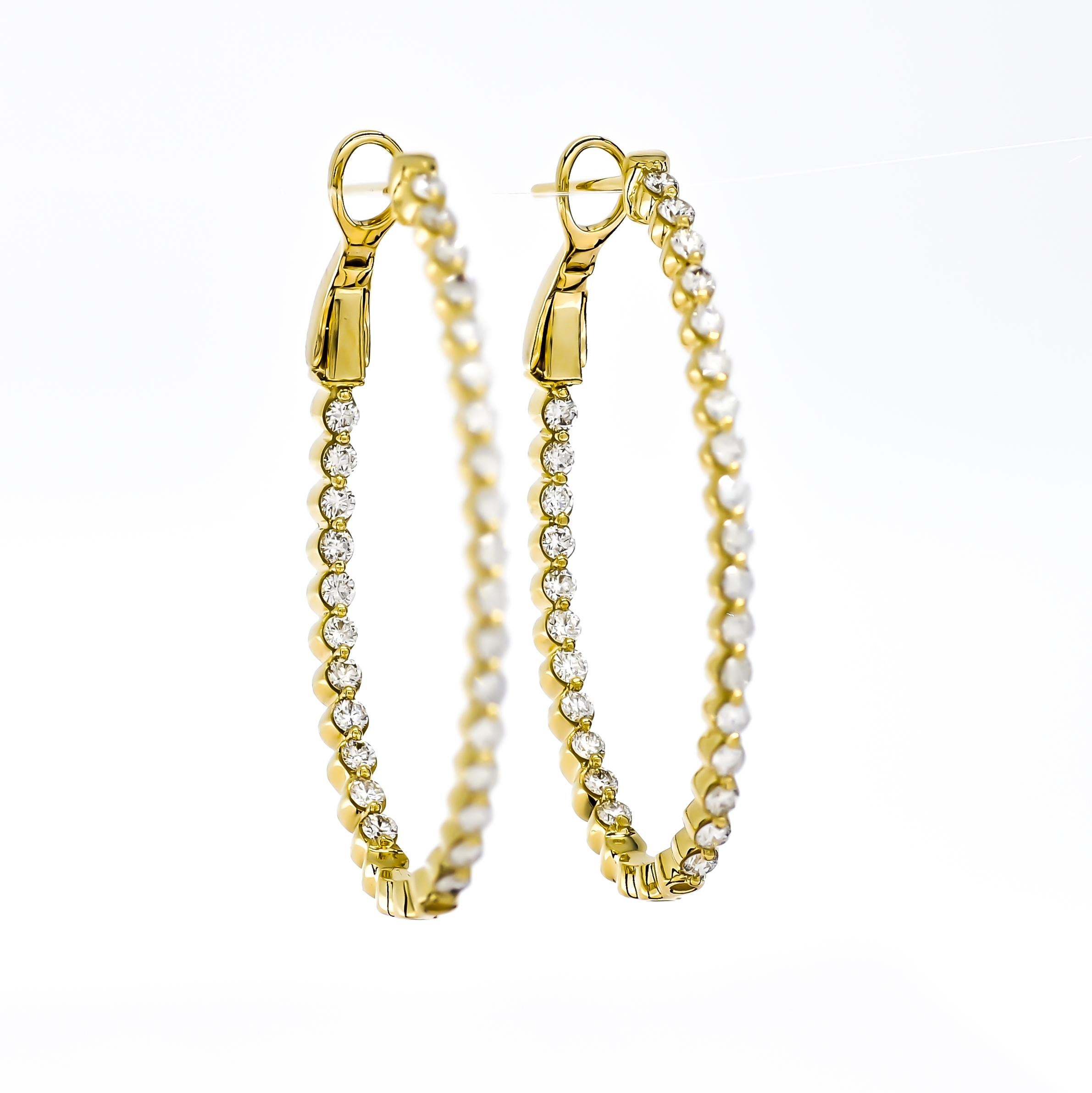 Feast your eyes on the 18KT Gold Single Row Diamond In and Out Hoop Huggies Earring, a symbol of pure sophistication and unmatched elegance. It's the perfect piece to enhance any ensemble, subtly showcasing a refined taste for luxury.

Crafted in