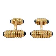 A Link in oro giallo 18KT con spirale e zaffiri blu cabochon