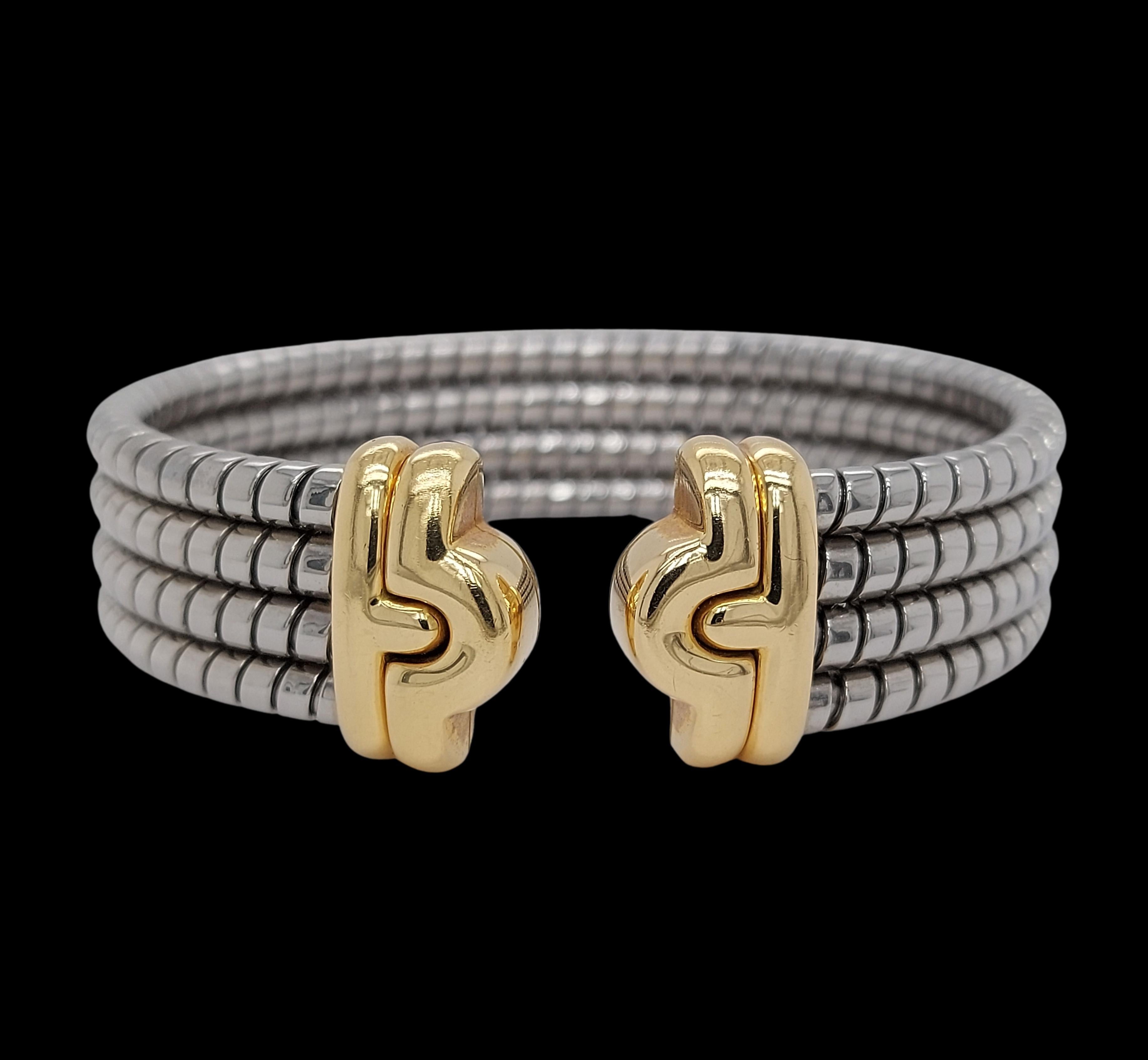 Stunning Bvlgari bracelet cuff with signature Parentesi Tubogas style. Stainless steel flexible body of the bracelet and 18k yellow gold ends.

Material: 18kt yellow gold, stainless steel

Measurements: The bracelet can fit a 17 cm wrist, but its
