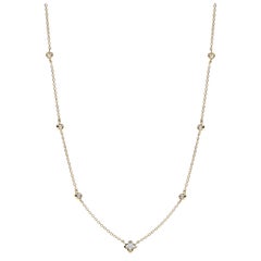 Collana con diamanti tondi e fiori in oro giallo 18KT 0,35ct in totale