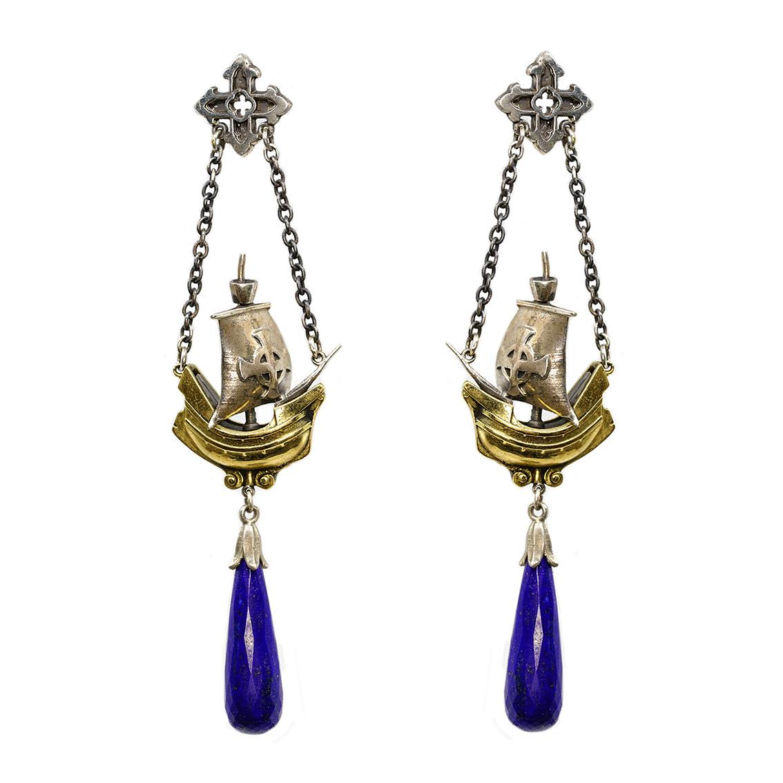 These medieval ship earrings are immaculate adornment for your ears. 

Handcrafted in 18kt yellow gold and sterling silver they resemble a medieval ship. Hanging from each earring is a deep, blue lapis lazuli briolette, 25mm in length and 7.3mm at