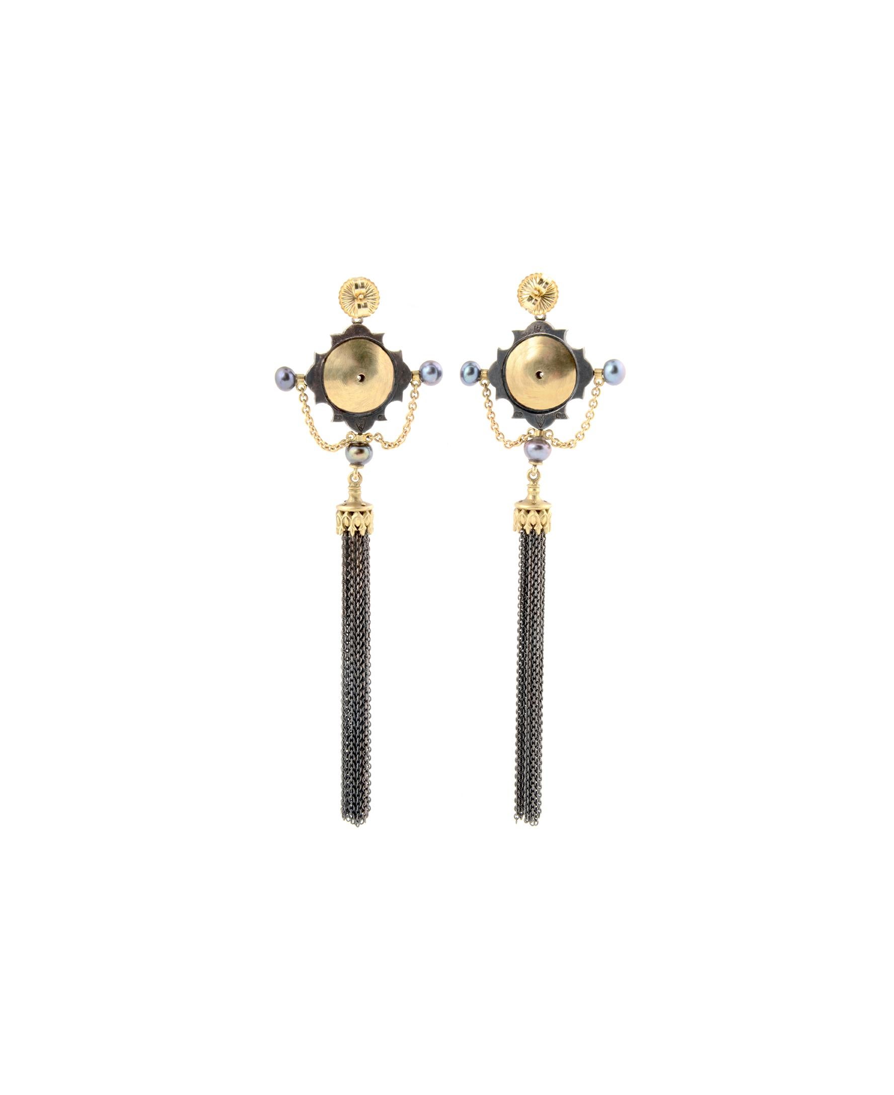 LUXURIANT TASSEL EARRINGS

The Luxuriant Tassel Earrings are one of a kind.

Handcrafted in 18kt yellow gold and sterling silver each earring features a vibrant, diamond which is flanked by four, stunning rubies. To complete these luminous earrings