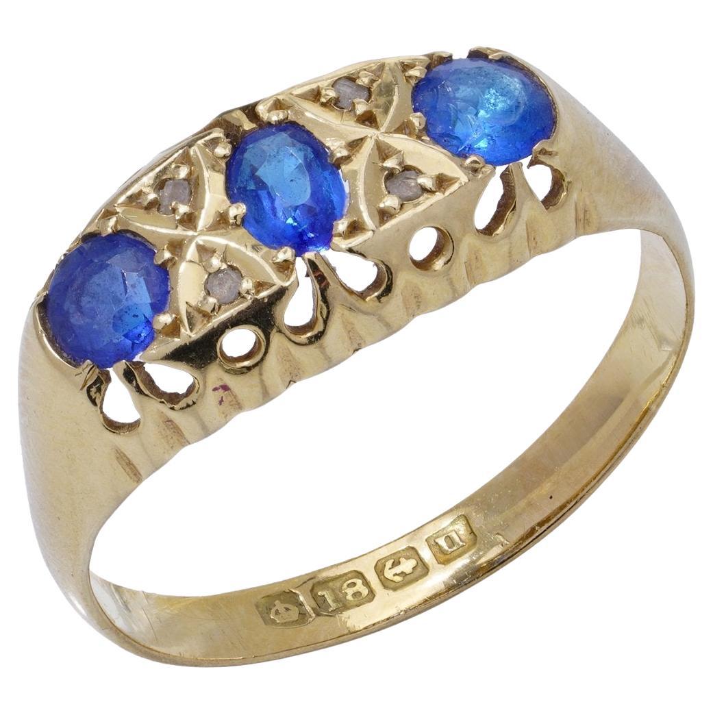 18kt yellow gold three - stone sapphire ring
