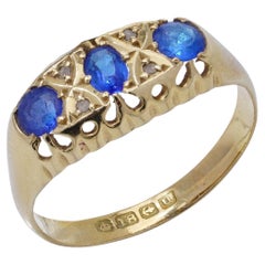 18kt yellow gold three - stone sapphire ring