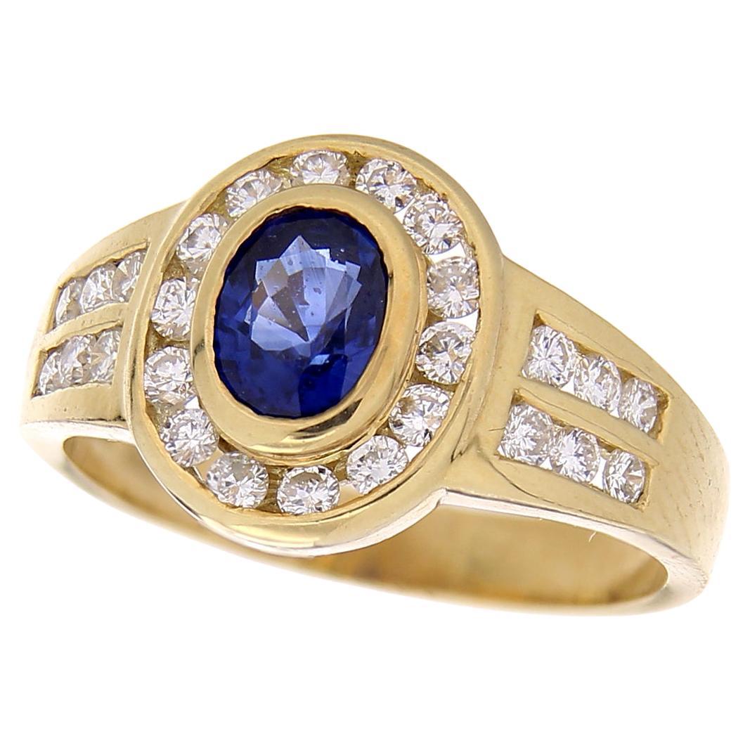 18 Karat Yellow Gold Vintage Ring 0.90 Ct Oval Sapphire & 0.51 Ct White Diamonds For Sale