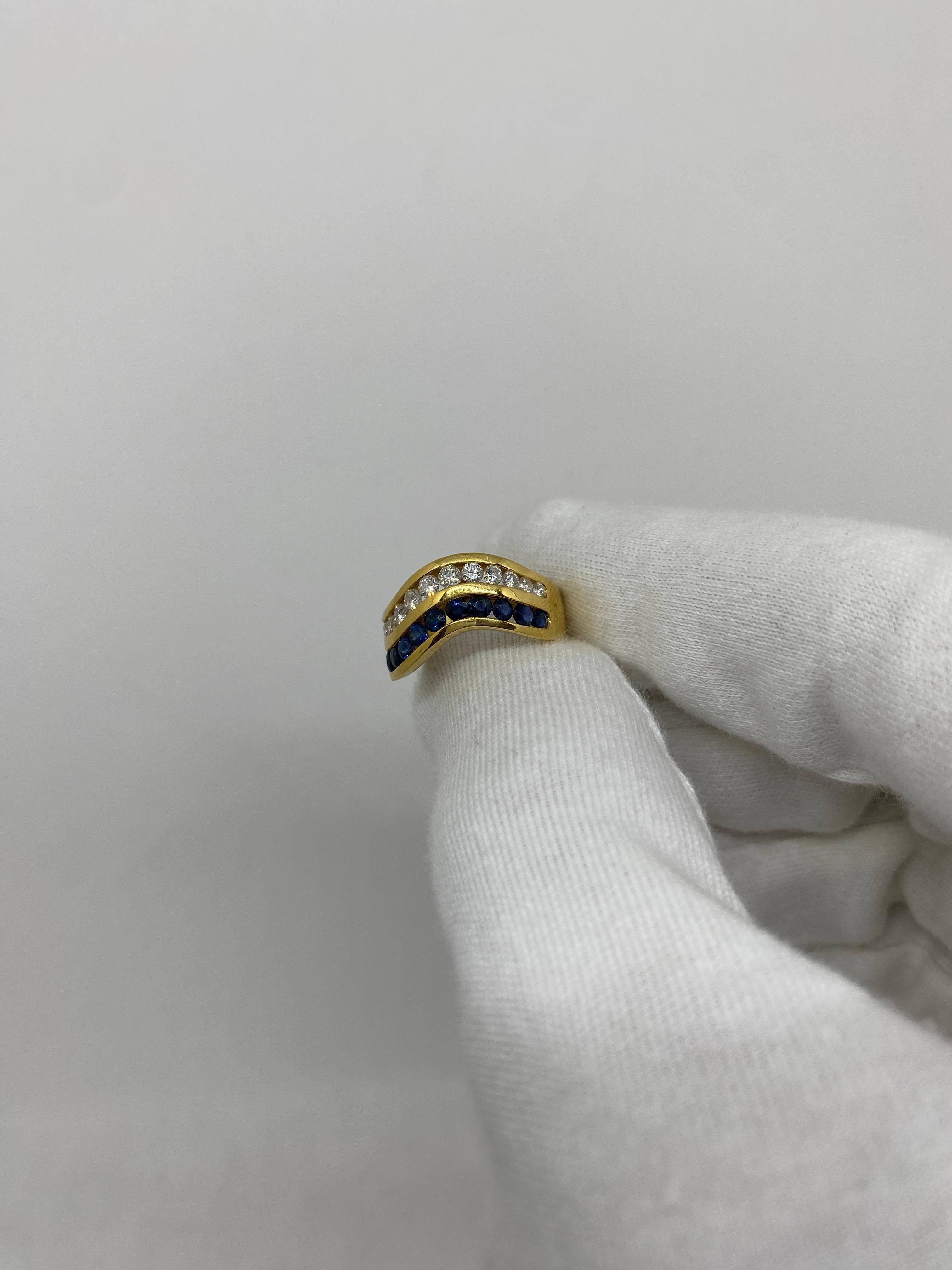 18-karat yellow gold band ring with brilliant-cut white natural diamonds for ct.0.92 and brilliant-cut blue sapphires for ct.1.33

Welcome to our jewelry collection, where every piece tells a story of timeless elegance and unparalleled