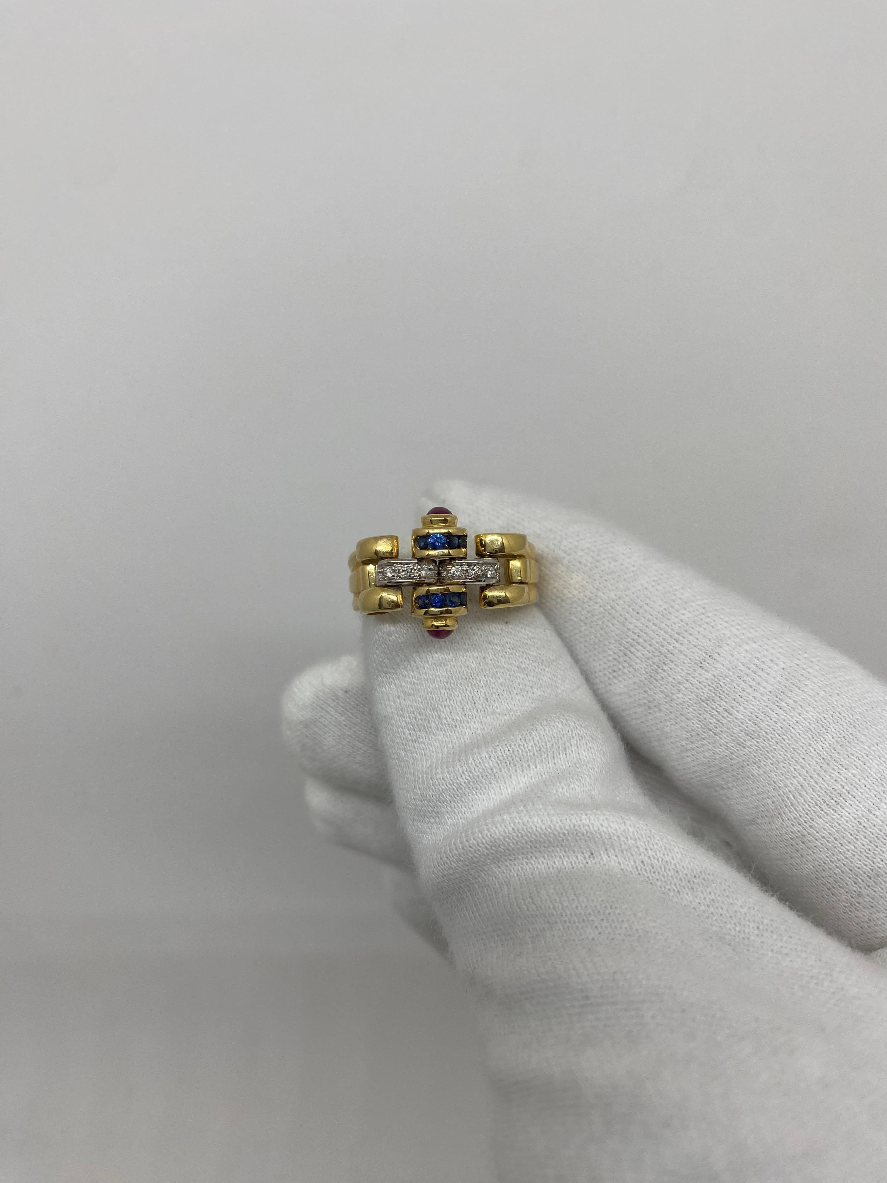 18Kt yellow gold band ring with natural white brilliant-cut diamonds and blue sapphires and red cabochon-cut rubies

Welcome to our jewelry collection, where every piece tells a story of timeless elegance and unparalleled craftsmanship. As a