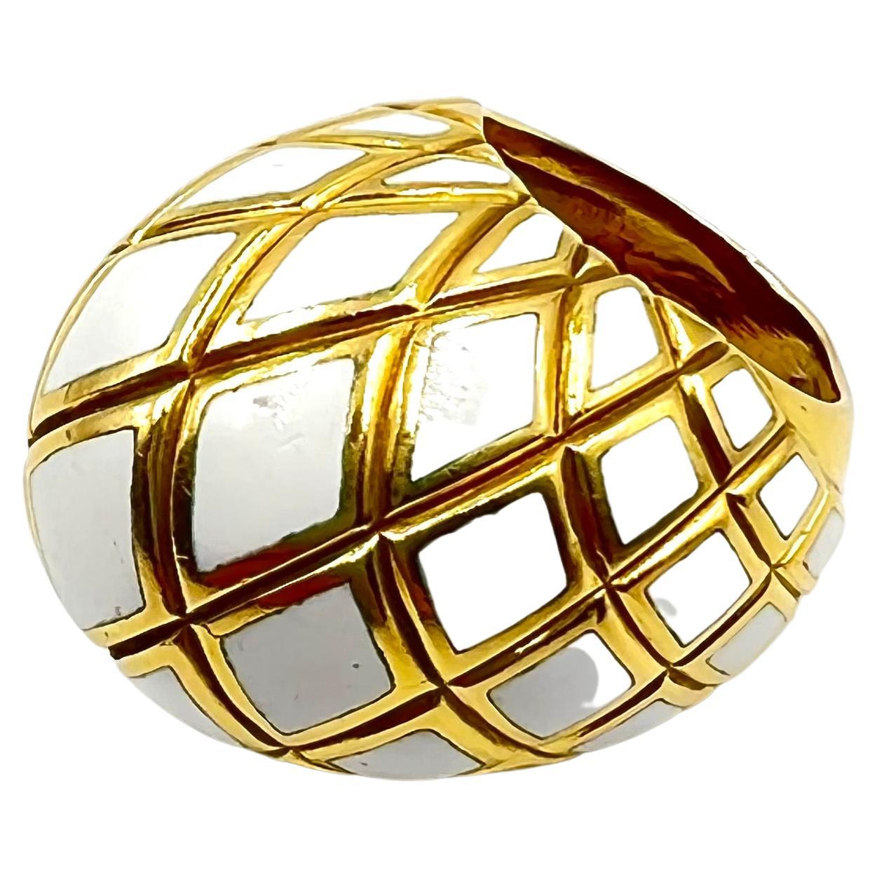 18kt yellow gold dome ring with a criss-cross design accented by white enamel.  Stylish dome top measuring W.22.82mm and tapering to 6.72mm at the shank.  Height of dome is approximately 18.5mm.  Hollowed out interior allows for comfortable wear. 