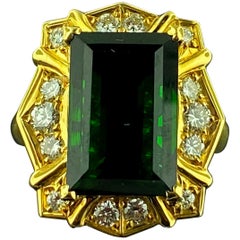 18 Karat Yellow Gold with a 7.50 Carat Green Tourmaline Center and Diamond Ring 18 Karat Yellow Gold with a 7.50 Carat Green Tourmaline Center and Diamond Ring