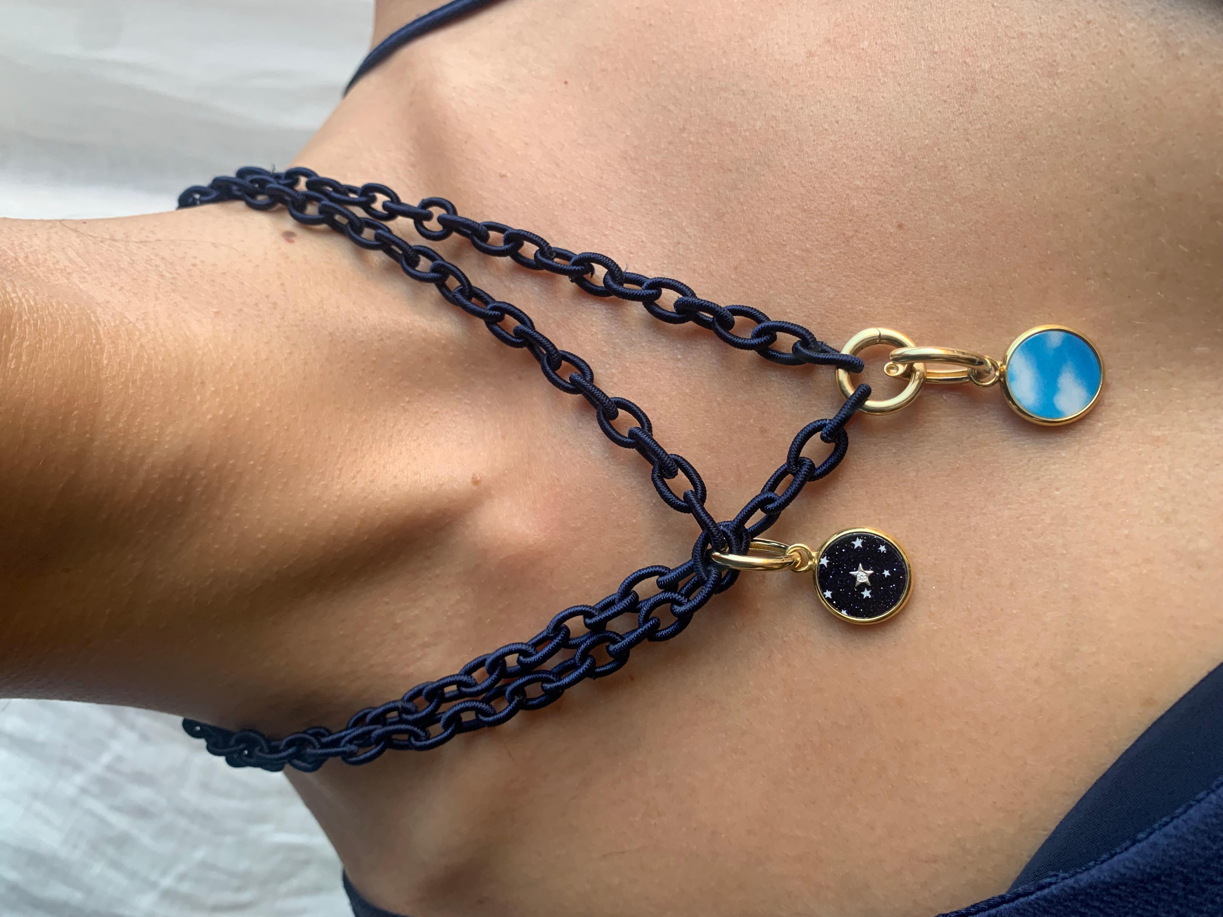 Silk Link Necklace in Navy Blue color
Chain links are wrapped in silk cord 
18k gold center ring opens to hold charms and functions as a clasp to adjust length 
35