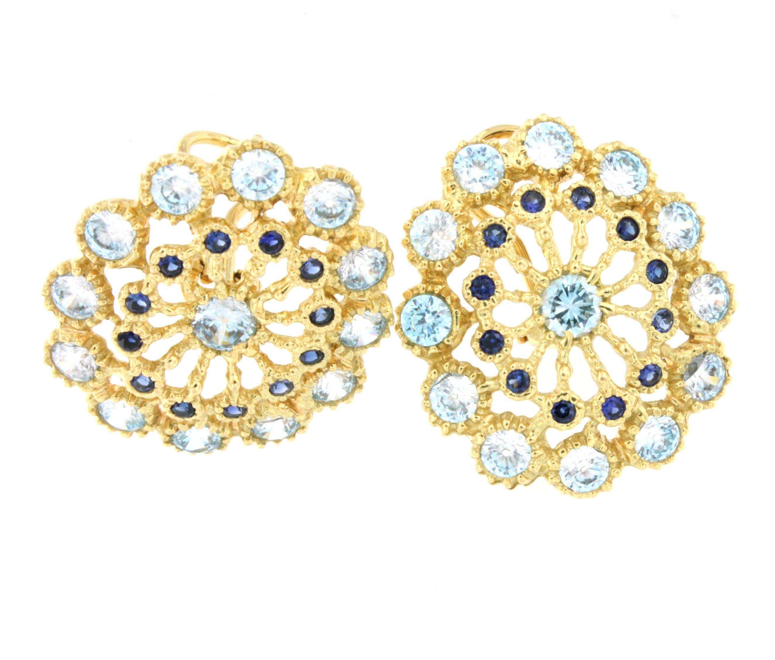gold earrings that seem embroidered, reminiscent of lace. They belong to a Stanoppi collection made in Italy since 1948 .

18Kt Yellow Gold with Blue Topaz and Blue Sapphires (no natural )  Fashion Clips Earrings 
g.18,30  

 All Stanoppi Jewelry is