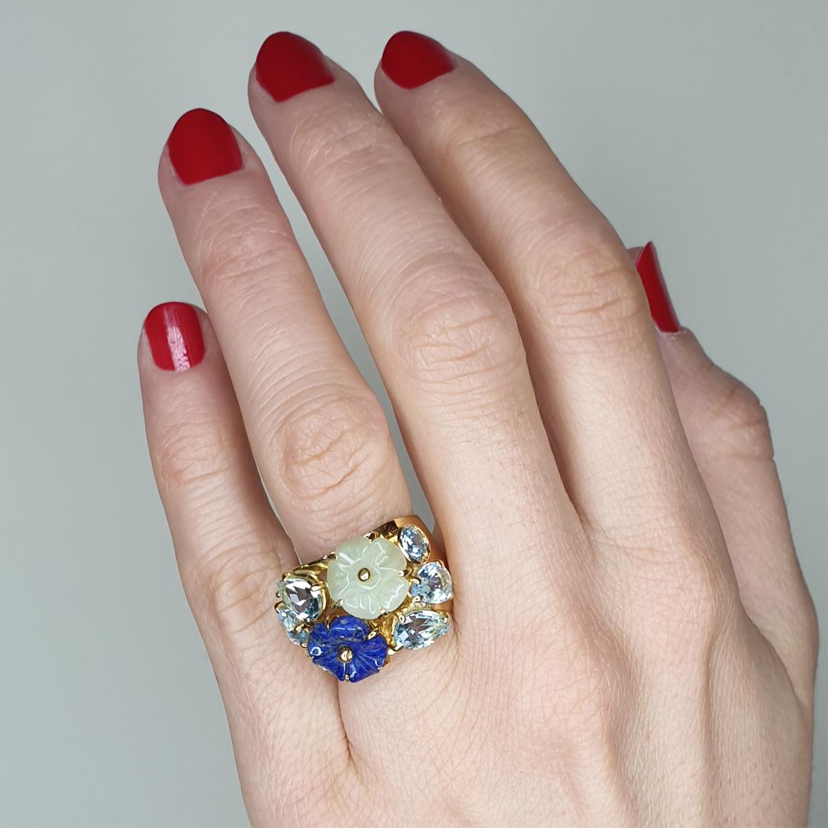 Beautiful bouchet of flowers create a unique jewel made in Italy by Stanoppi Jewellery since 1948.
Very trendy and pretty ring by Stanoppi Jewellery . The combination of colors and stones is very unique. 
flowers of Giada and Lapis ( size: 10mm),