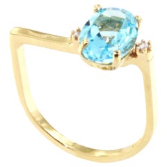 Bague en or jaune 18Kt avec pierre de topaze bleue naturelle et zircon Design/One