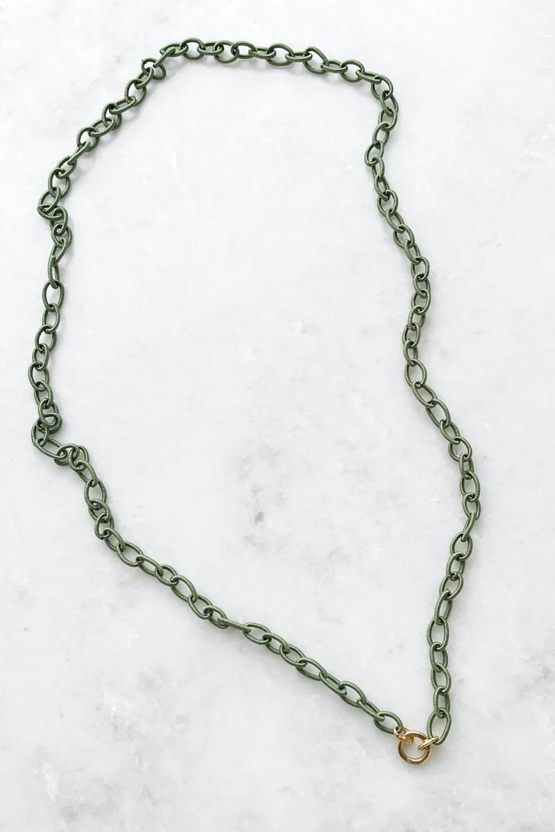Silk Link Necklace in Sage 
Chain links are wrapped in silk cord 
18k gold center ring opens to hold charms and functions as a clasp to adjust length 
35