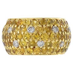 Anillo de oro amarillo de 18 quilates con zafiro amarillo y diamantes