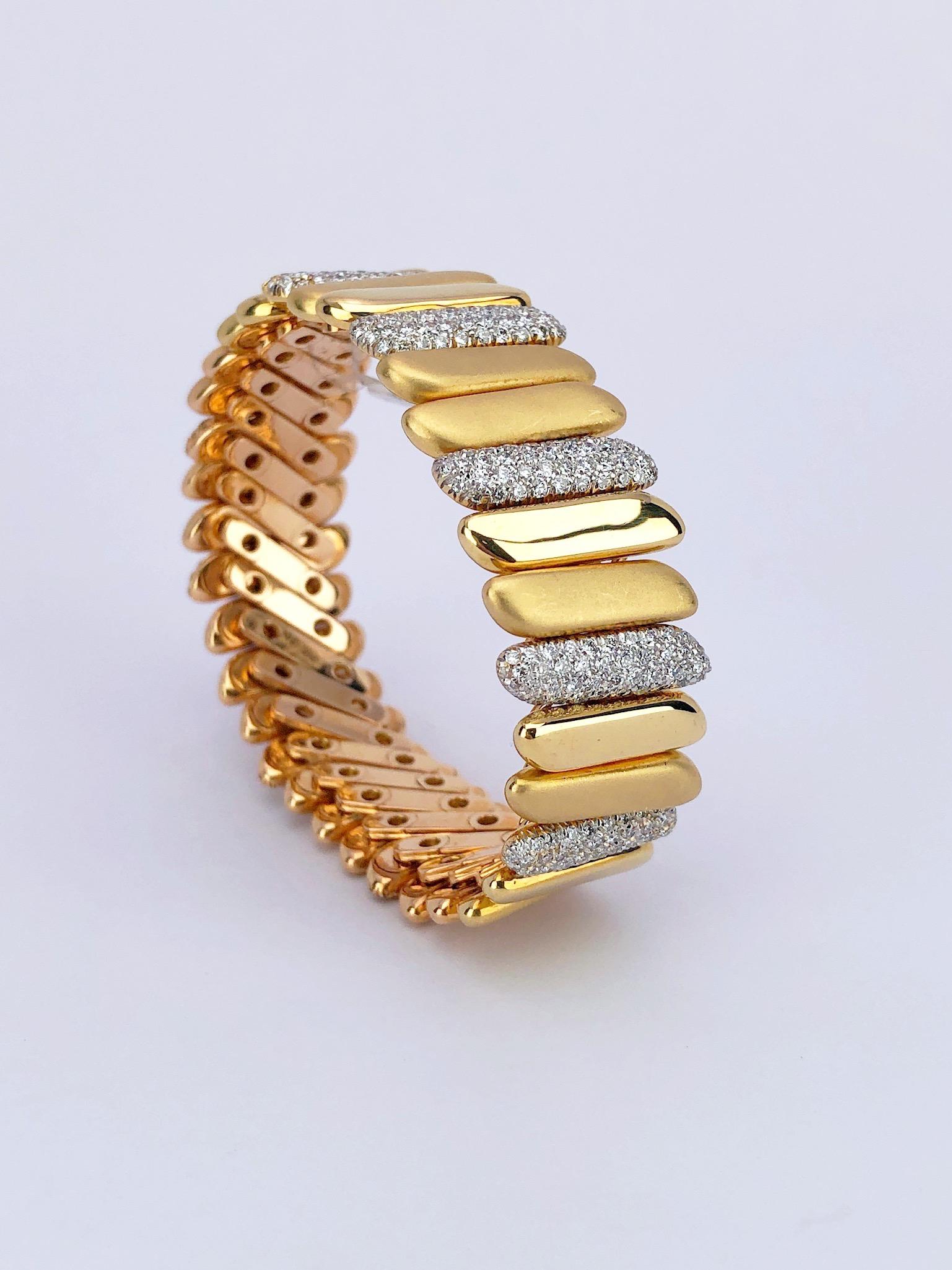 The best of both worlds describes this bracelet perfectly. Composed of rose gold links set with cognac diamonds, along with polished and satin finished same shape motifs. The reverse side is yellow gold with pave diamonds set in white gold following