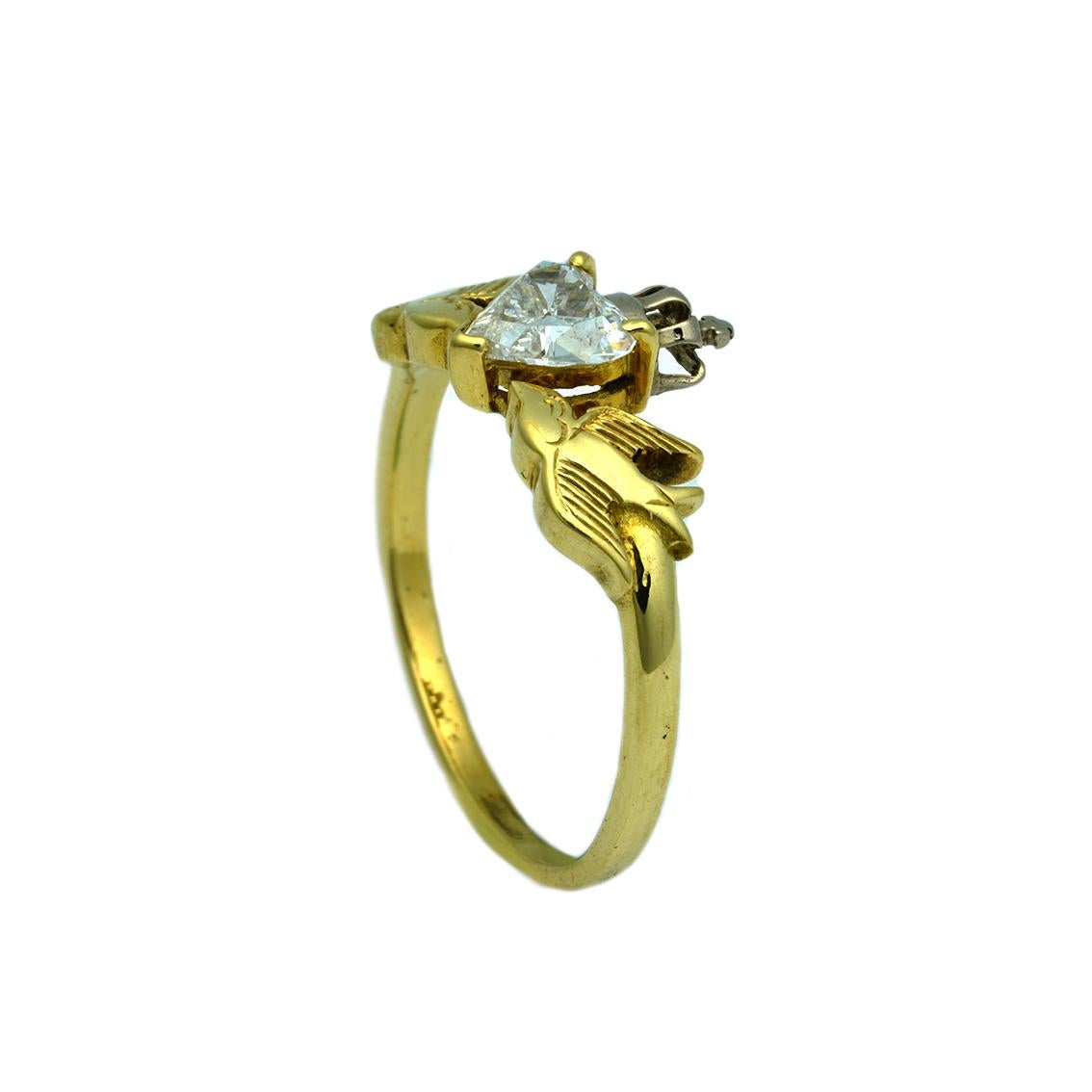This Crowned Heart & Swallows Ring is a splendid piece and would make an enchanting engagement ring. 

Handmade in 18kt yellow and white gold, the ring features a heart, brilliant cut diamond, claw set approximately 0.55ct in weight, P1 in clarity
